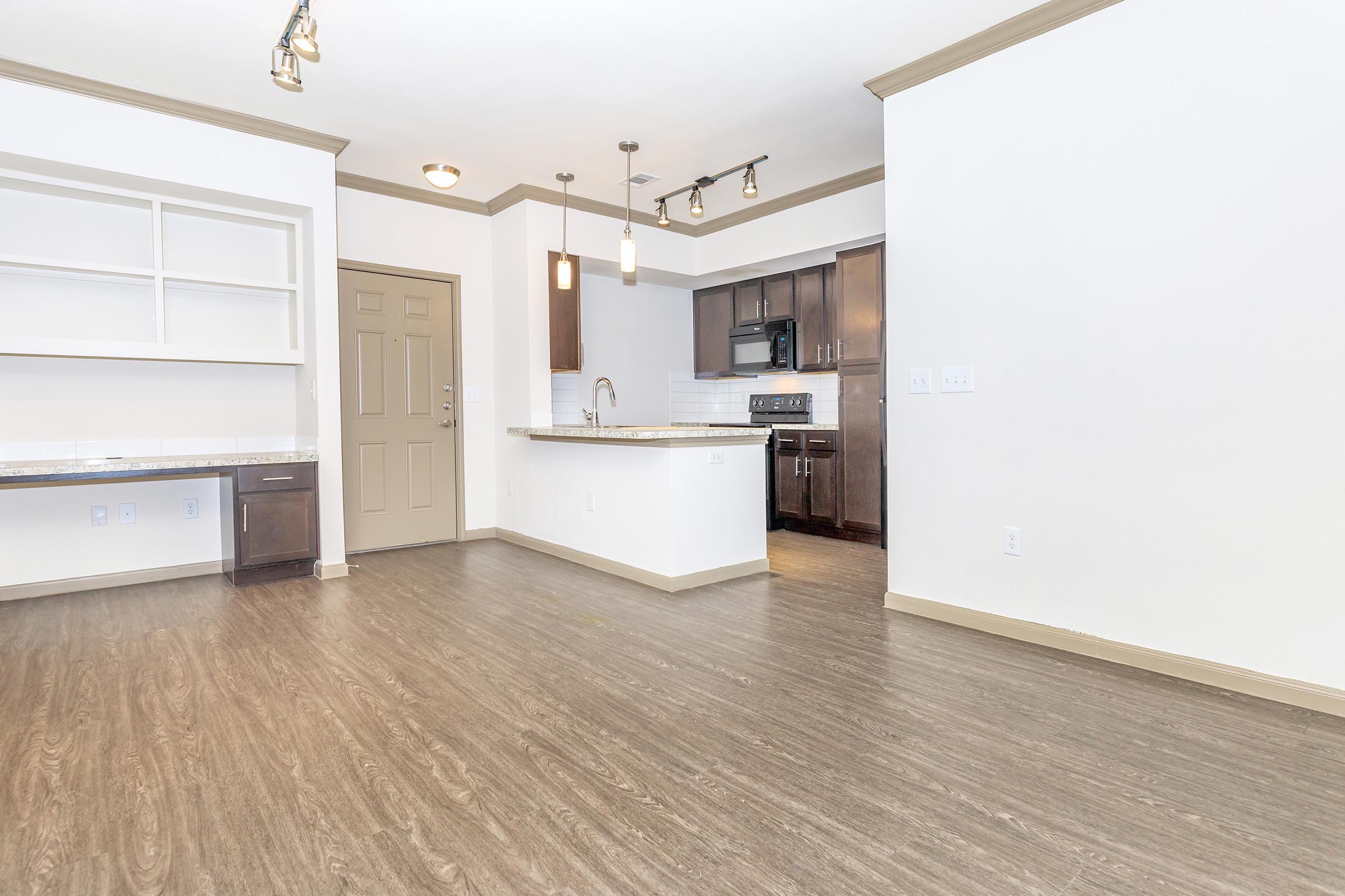 a kitchen area with a building in the background