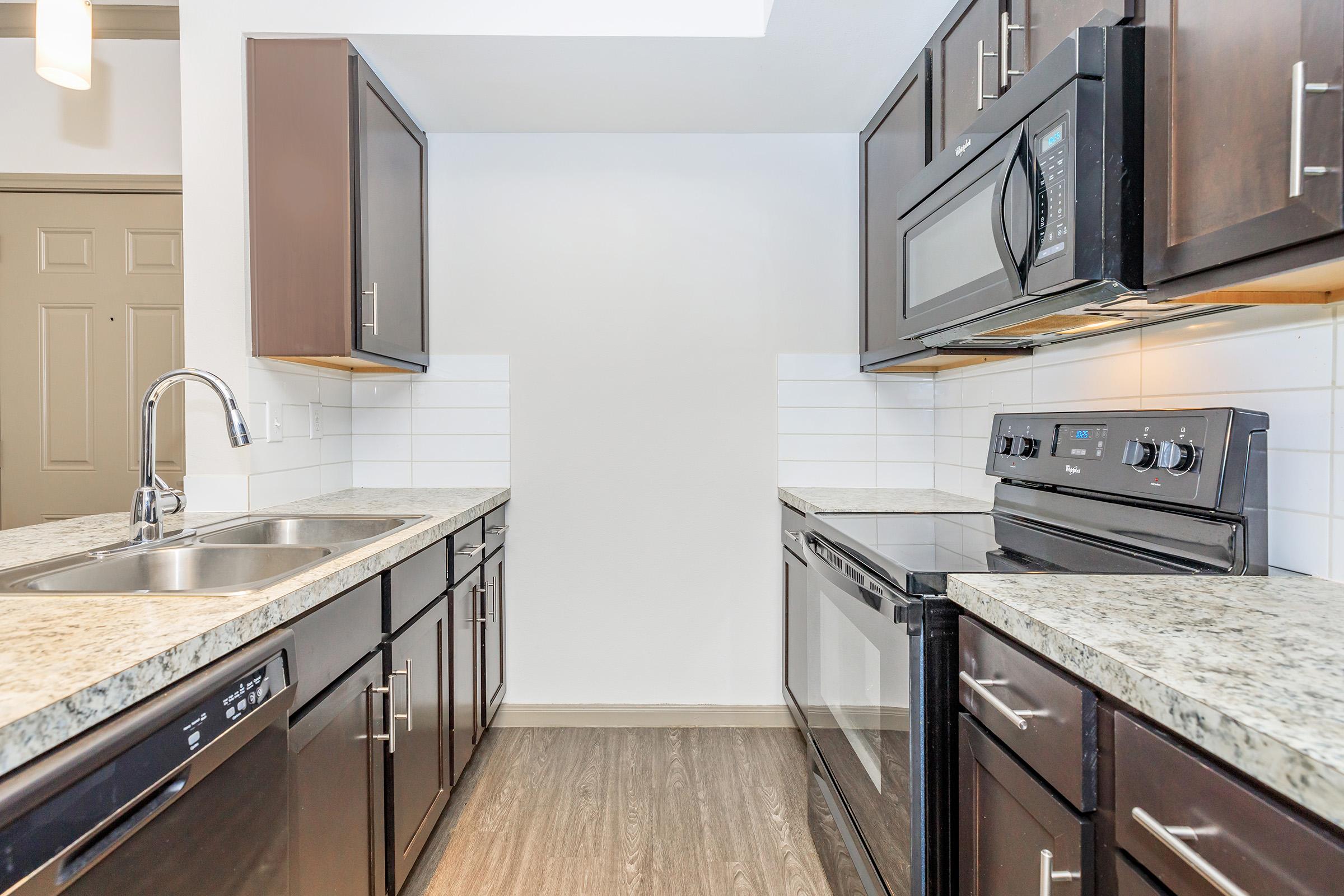 a kitchen with stainless steel appliances