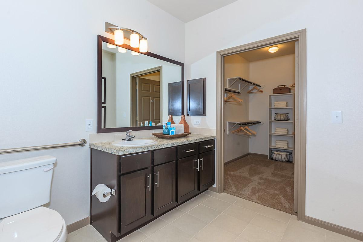 a kitchen with a sink and a mirror