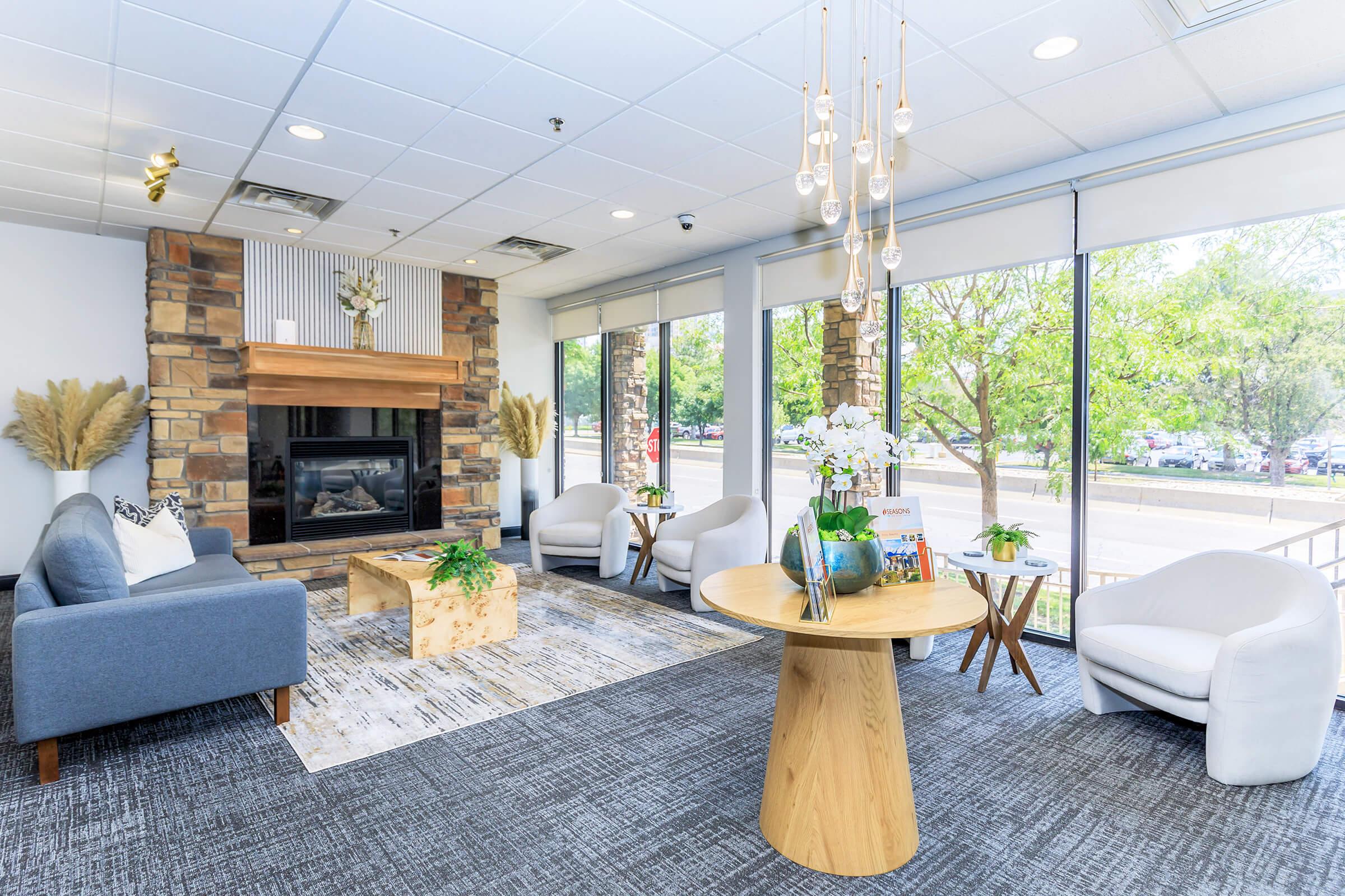 a living room filled with furniture and a large window