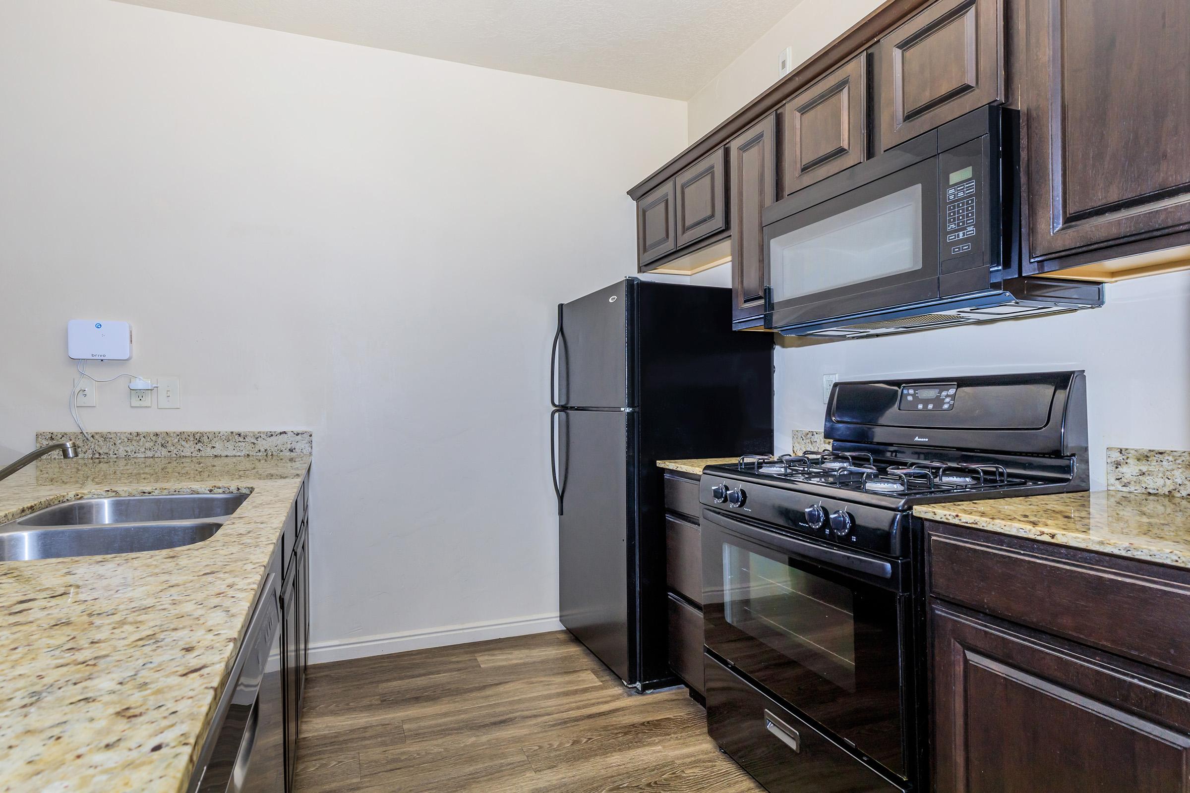 a large kitchen with stainless steel appliances