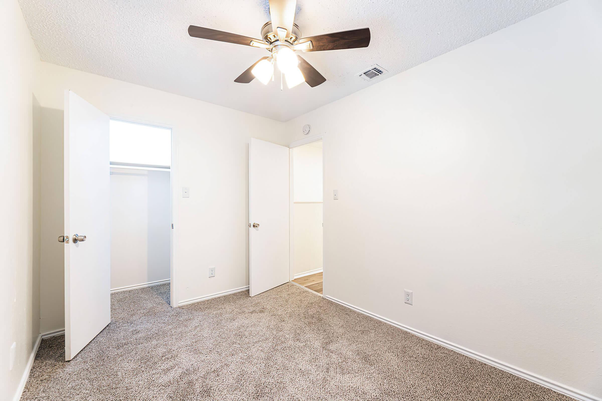 a bedroom with a large mirror