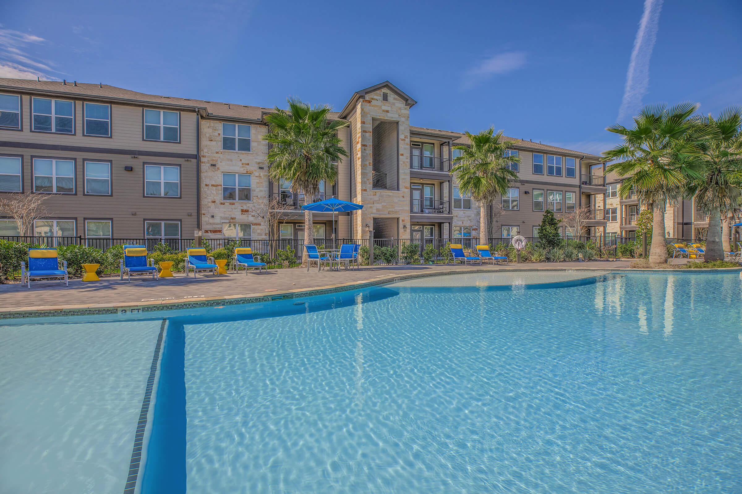 a large pool of water in front of a building