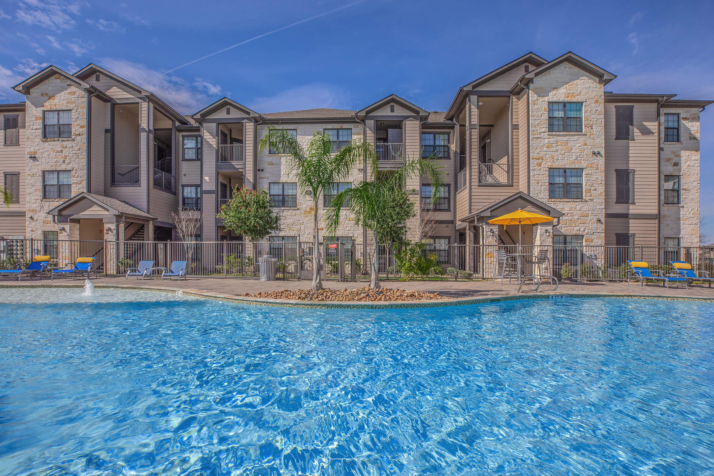 a house with a large pool of water