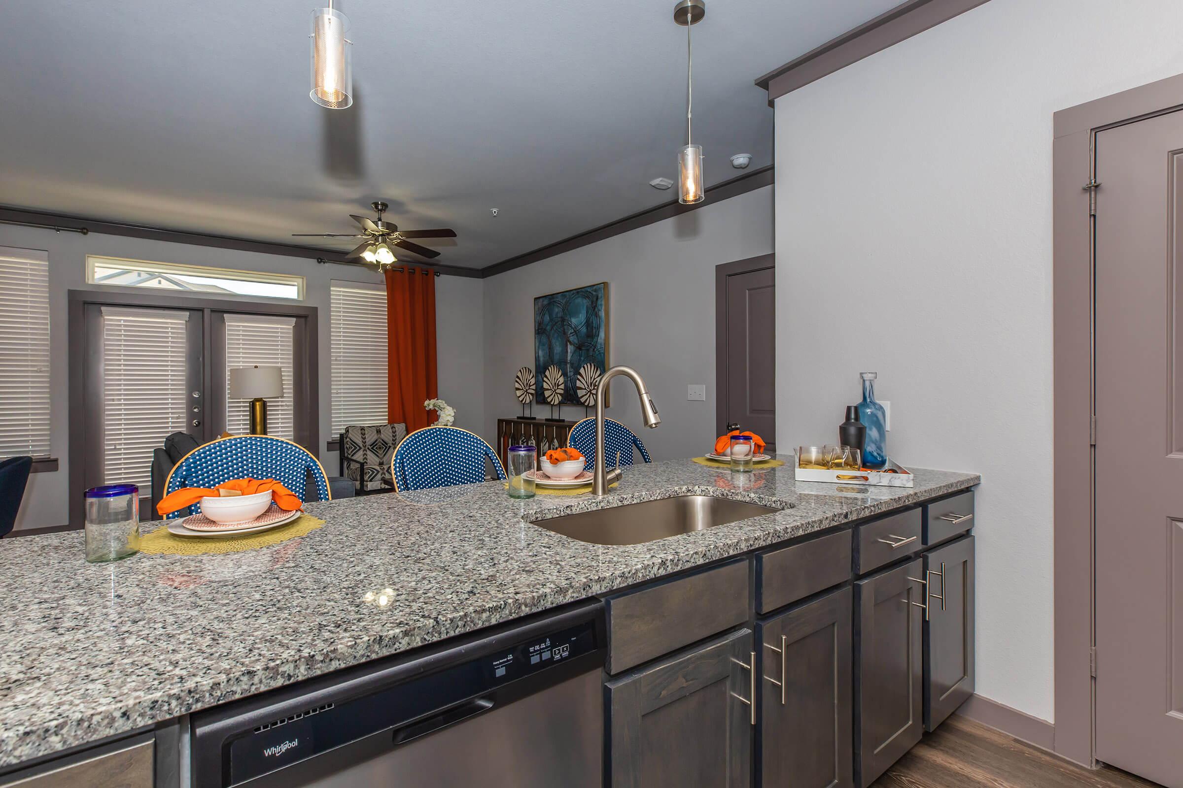 a kitchen with a sink and a microwave