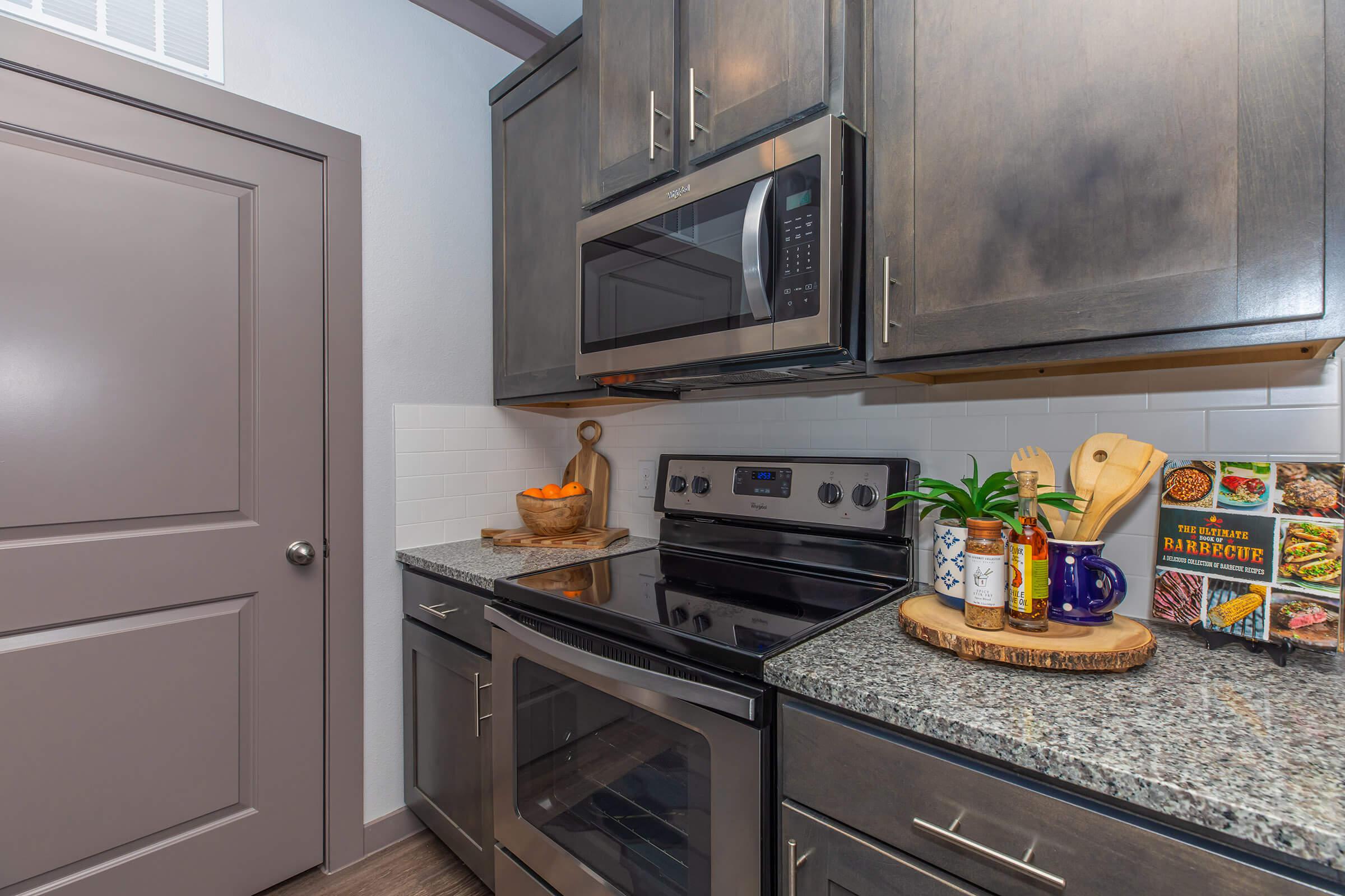 a stove top oven sitting inside of a kitchen counter