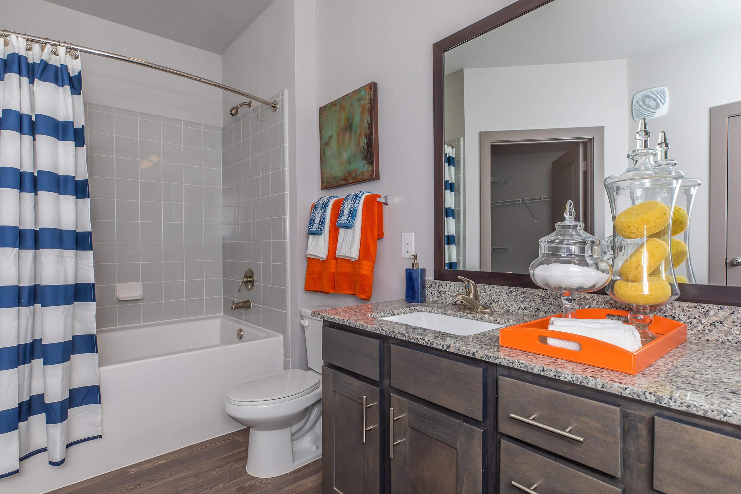 a kitchen with a sink and a mirror