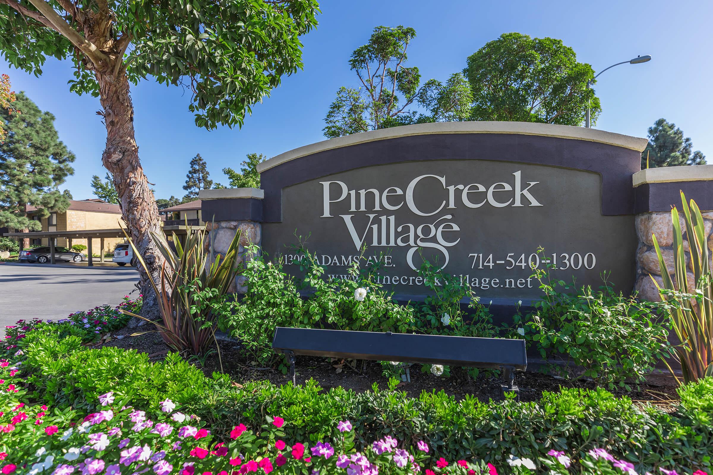 Pinecreek Village Apartments monument sign