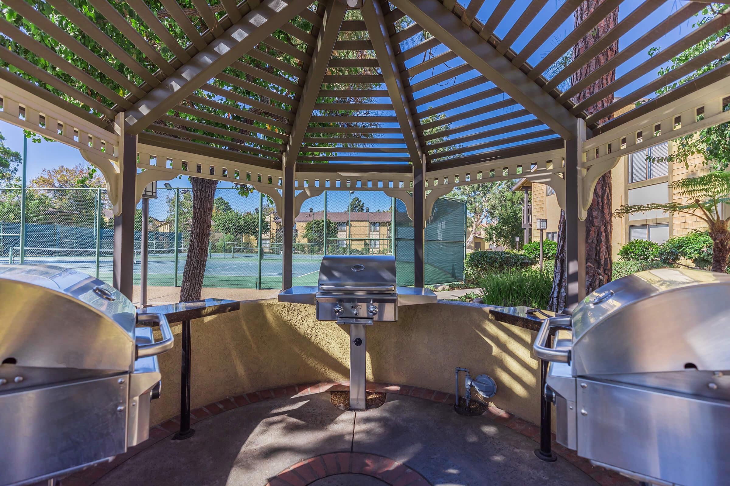 Stainless steel barbecues under a gazebo