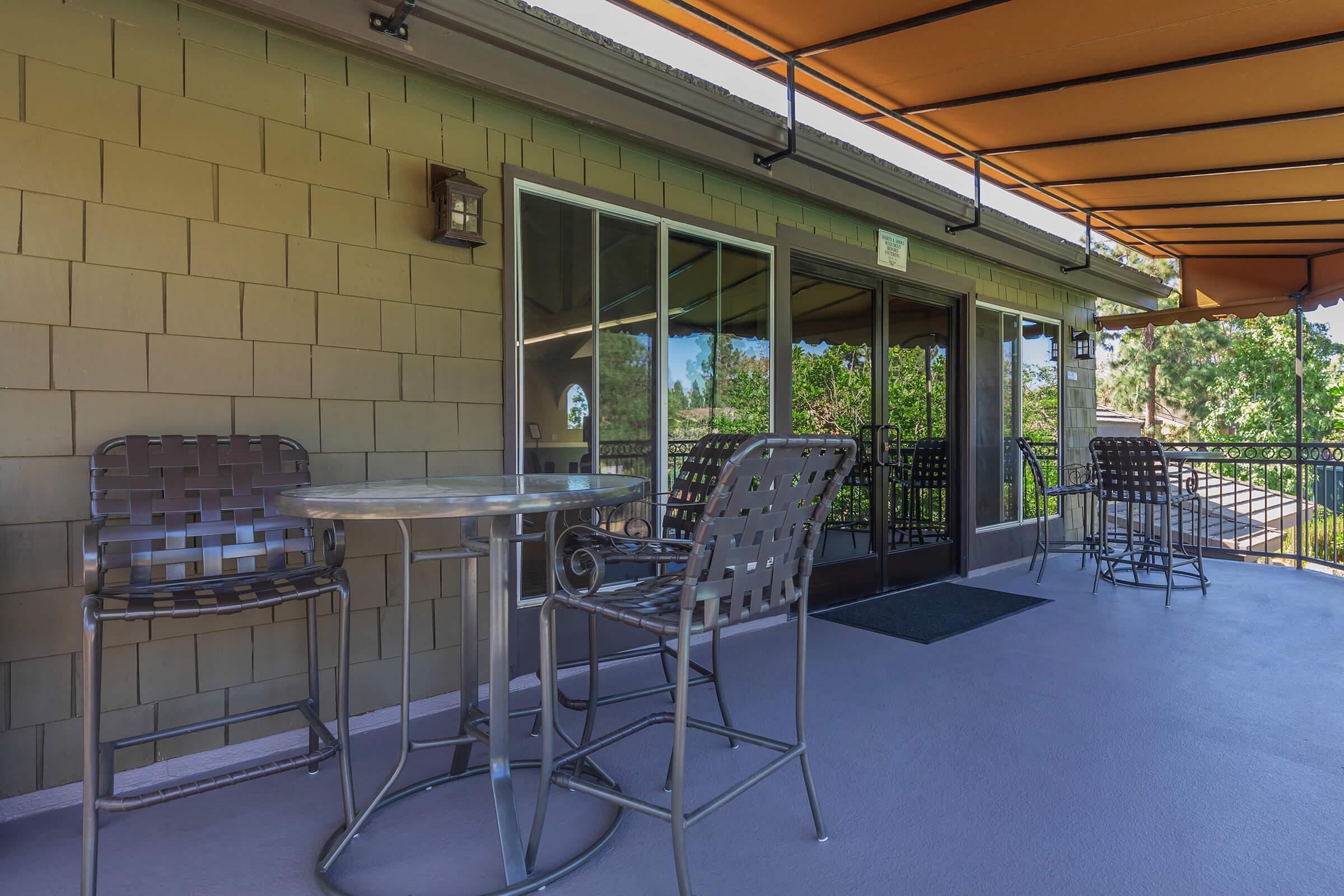 Chairs and tables on a community patio