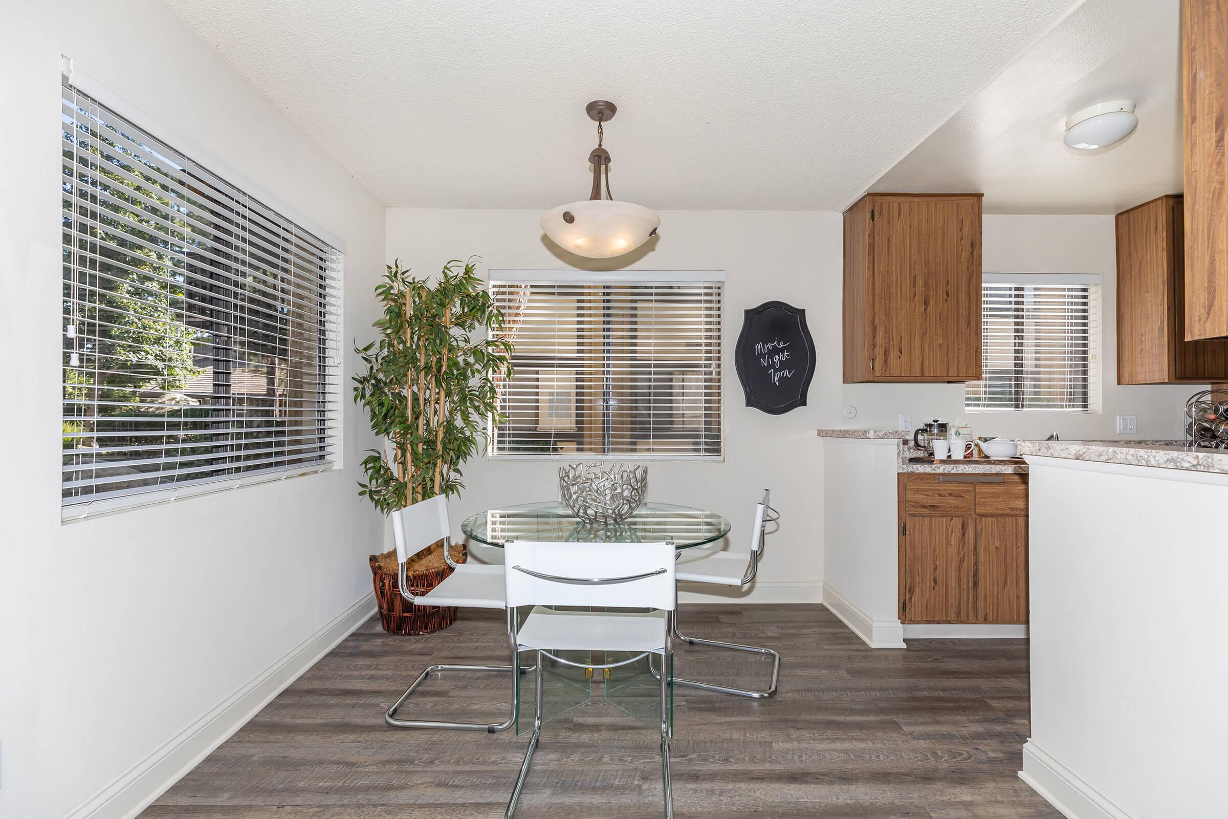 Dining room and kitchen with wooden floors