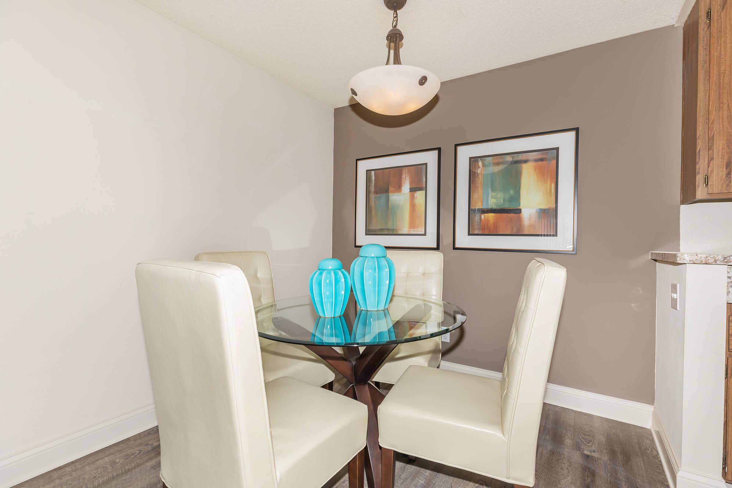 Dining room with white chairs and a table