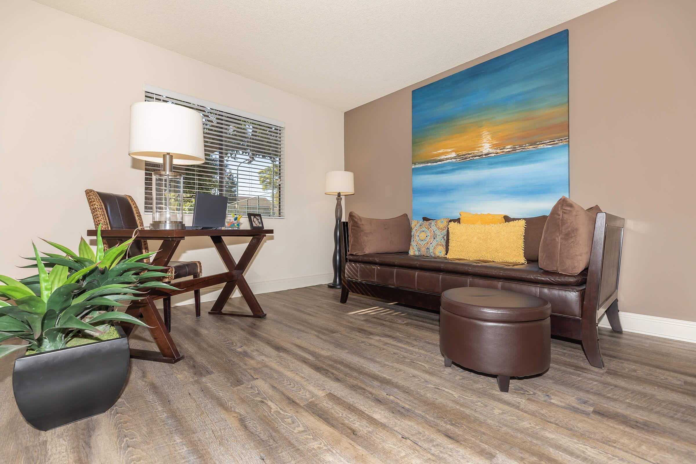 A room with a brown couch