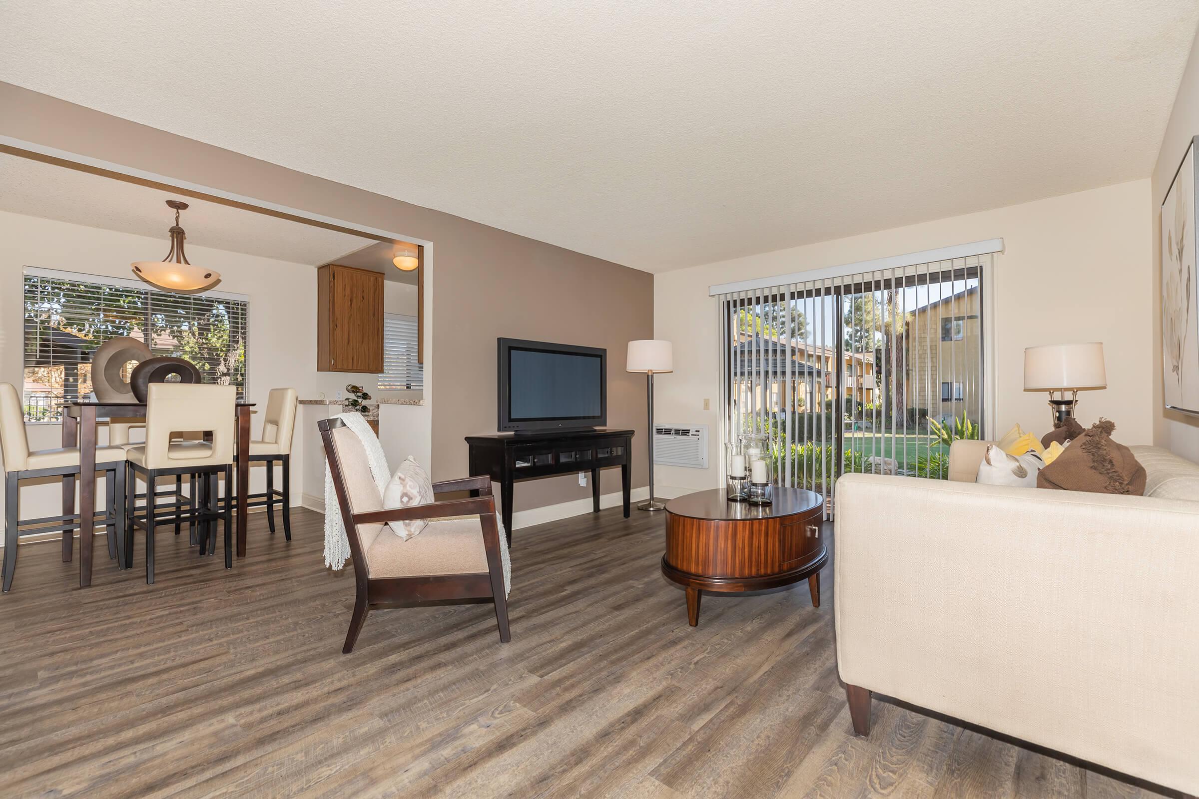 Living room and dining room with wooden floors