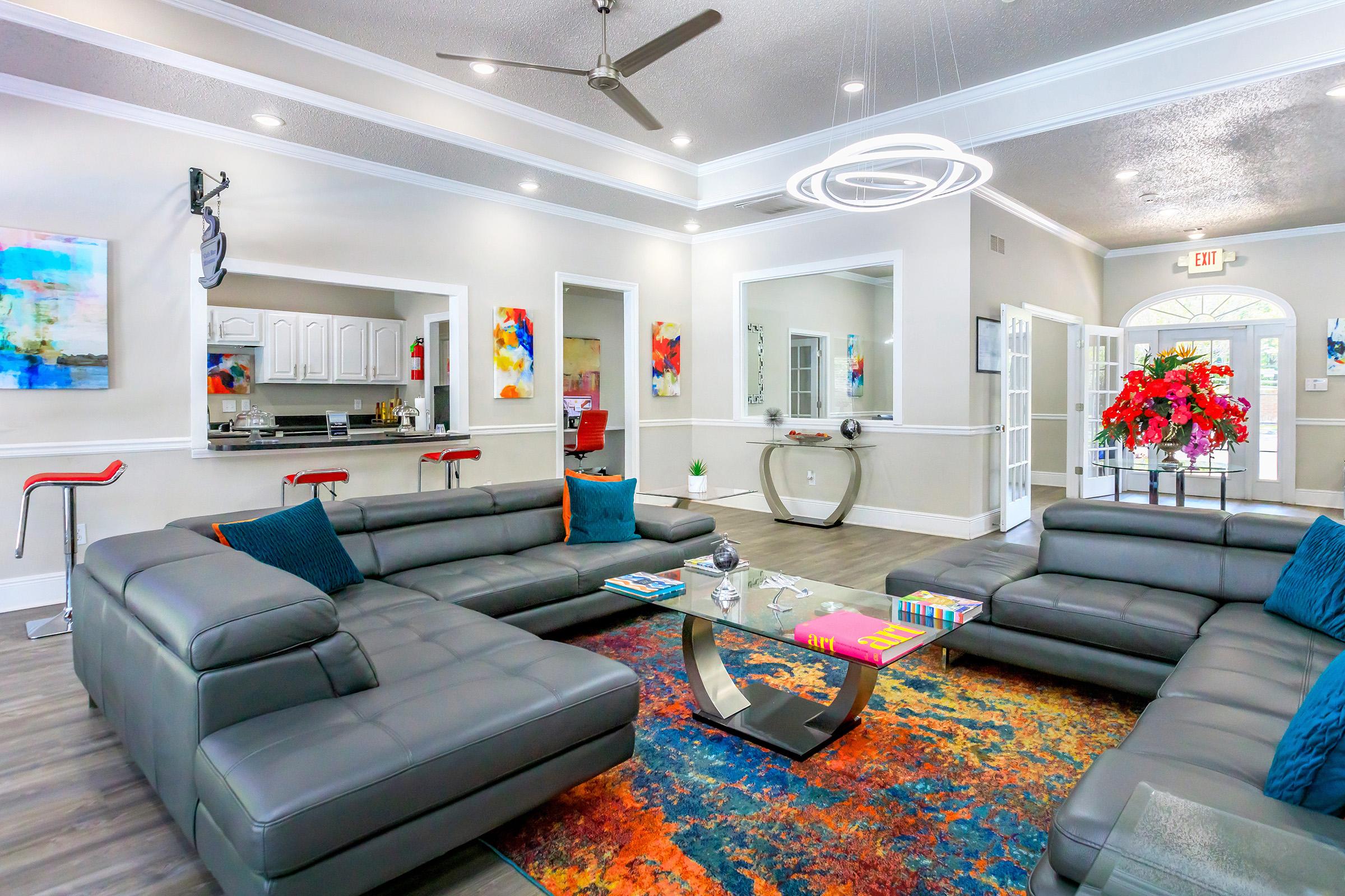 a living room filled with furniture and a flat screen tv