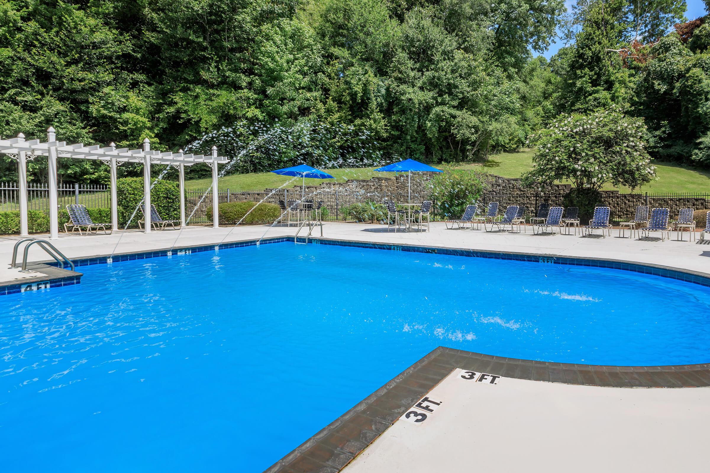 a pool next to a body of water