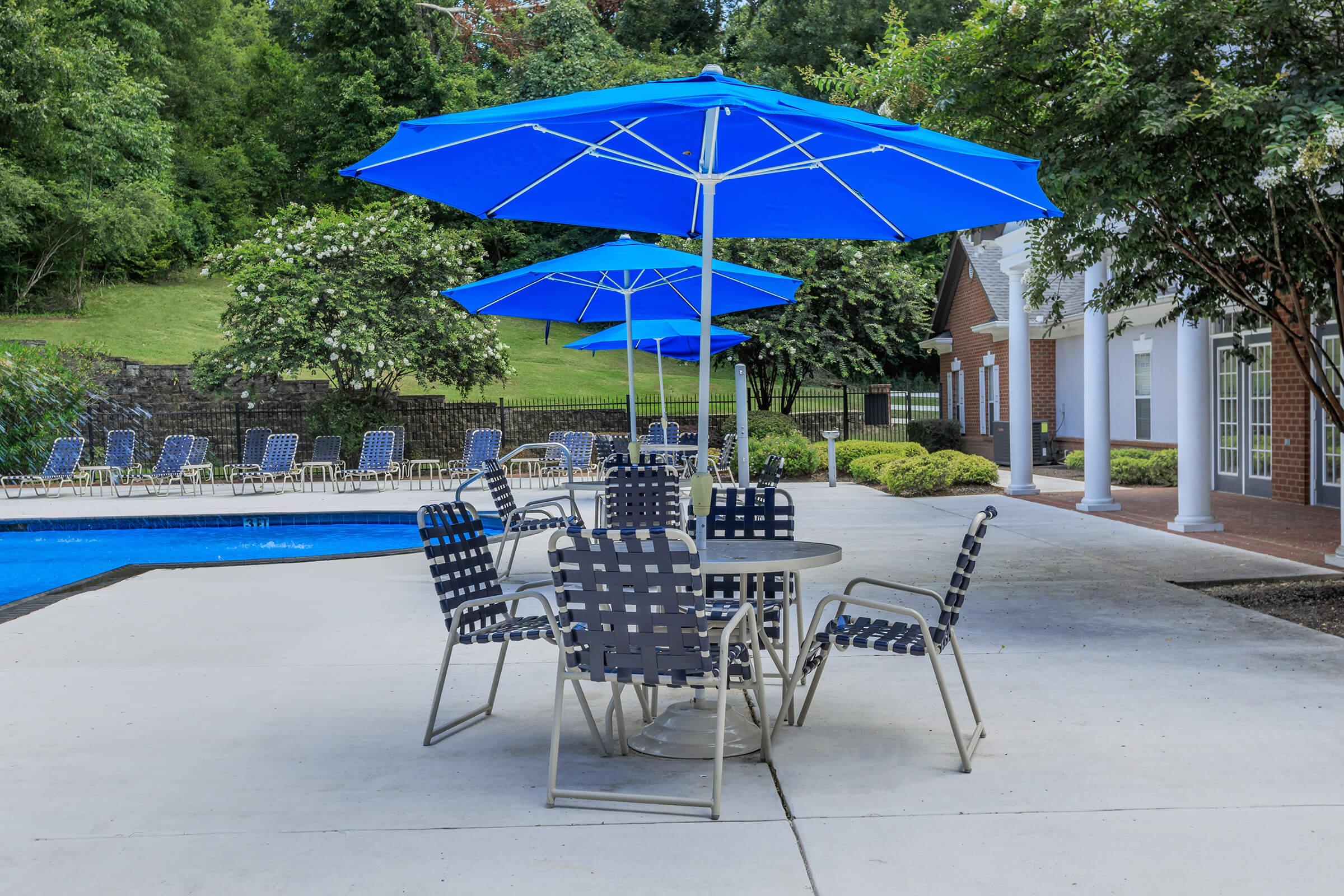 a lawn chair under an umbrella