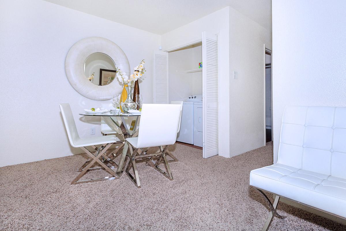 a bedroom with a bed and desk in a small room