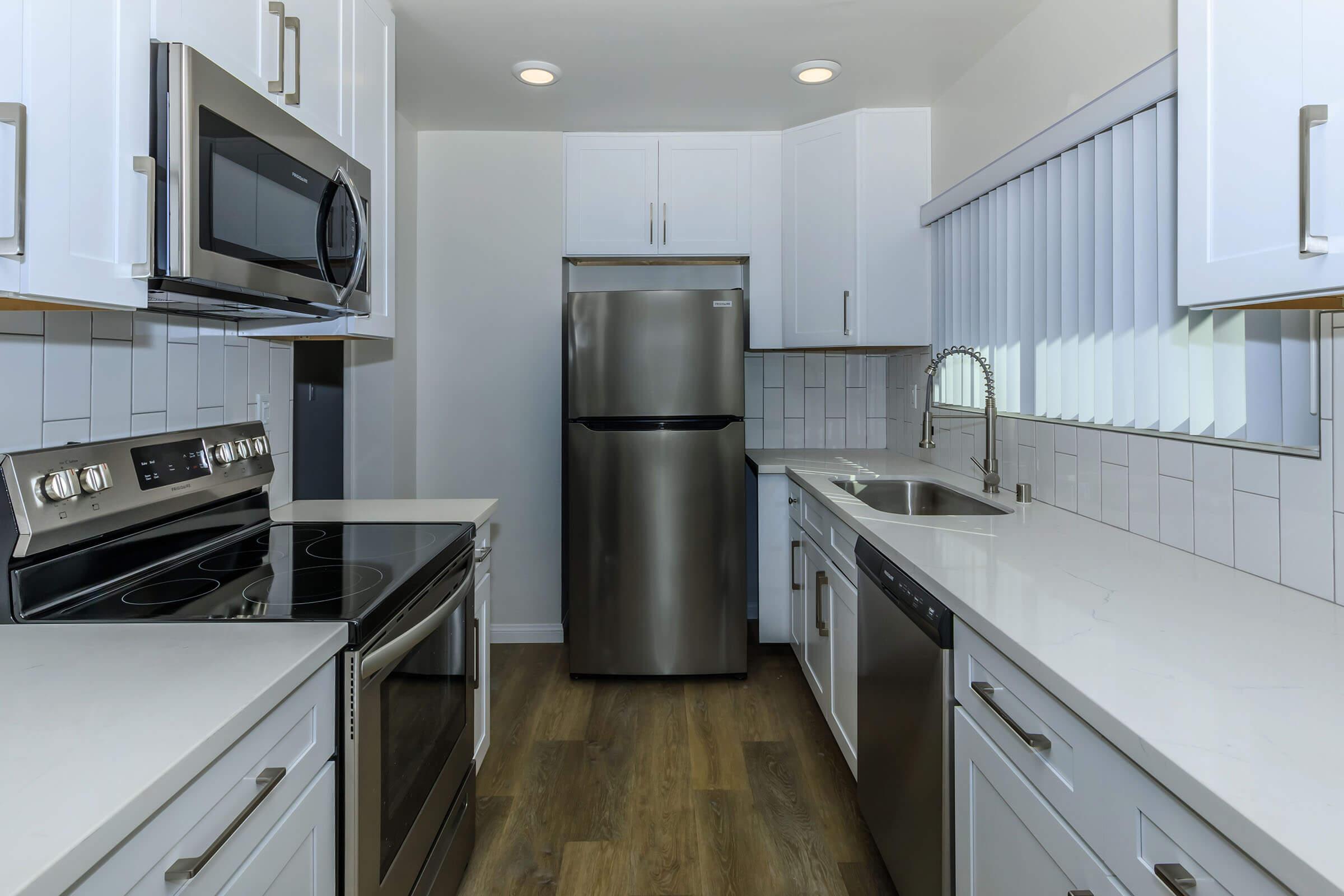 a kitchen with stainless steel appliances