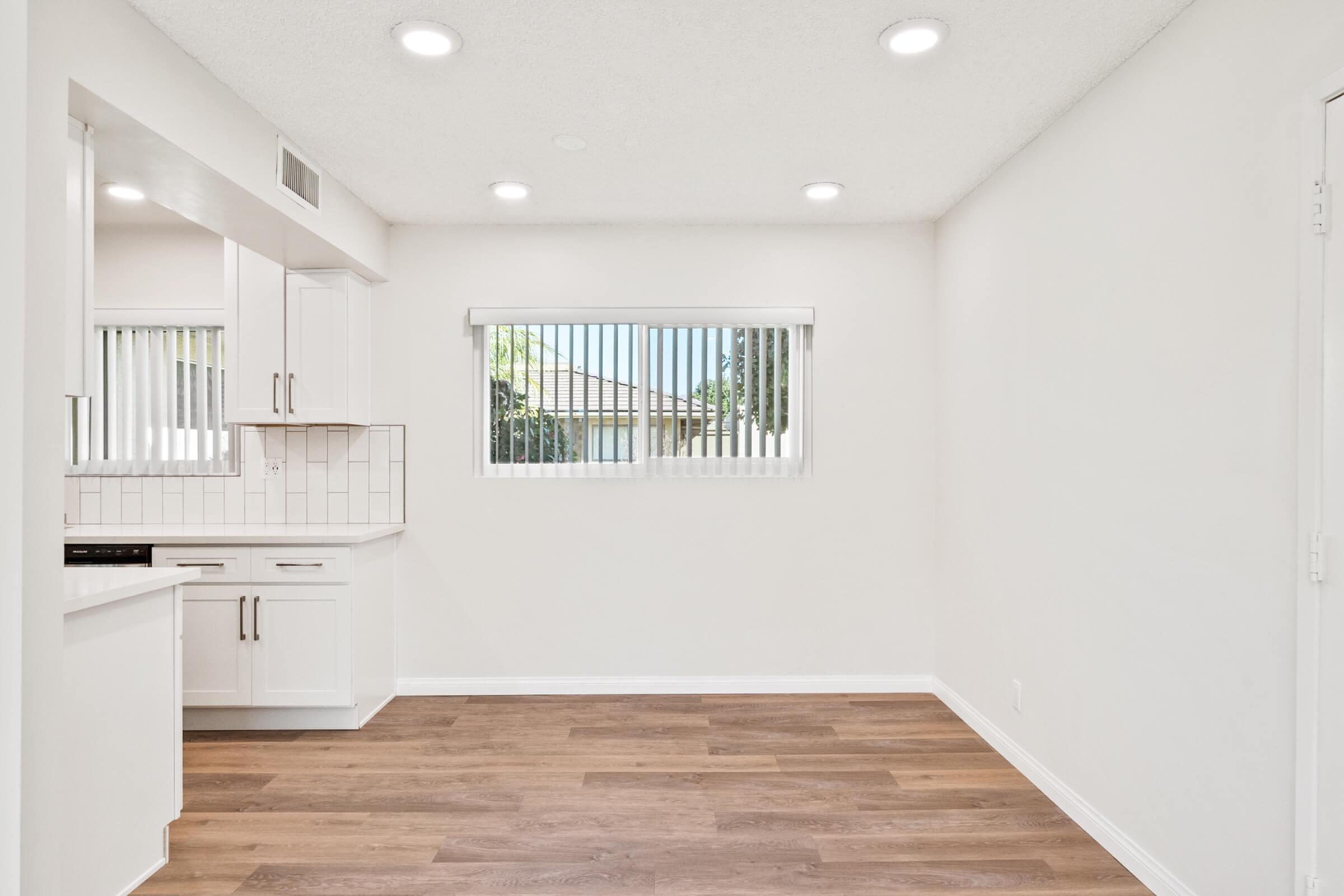 a kitchen with a wood floor