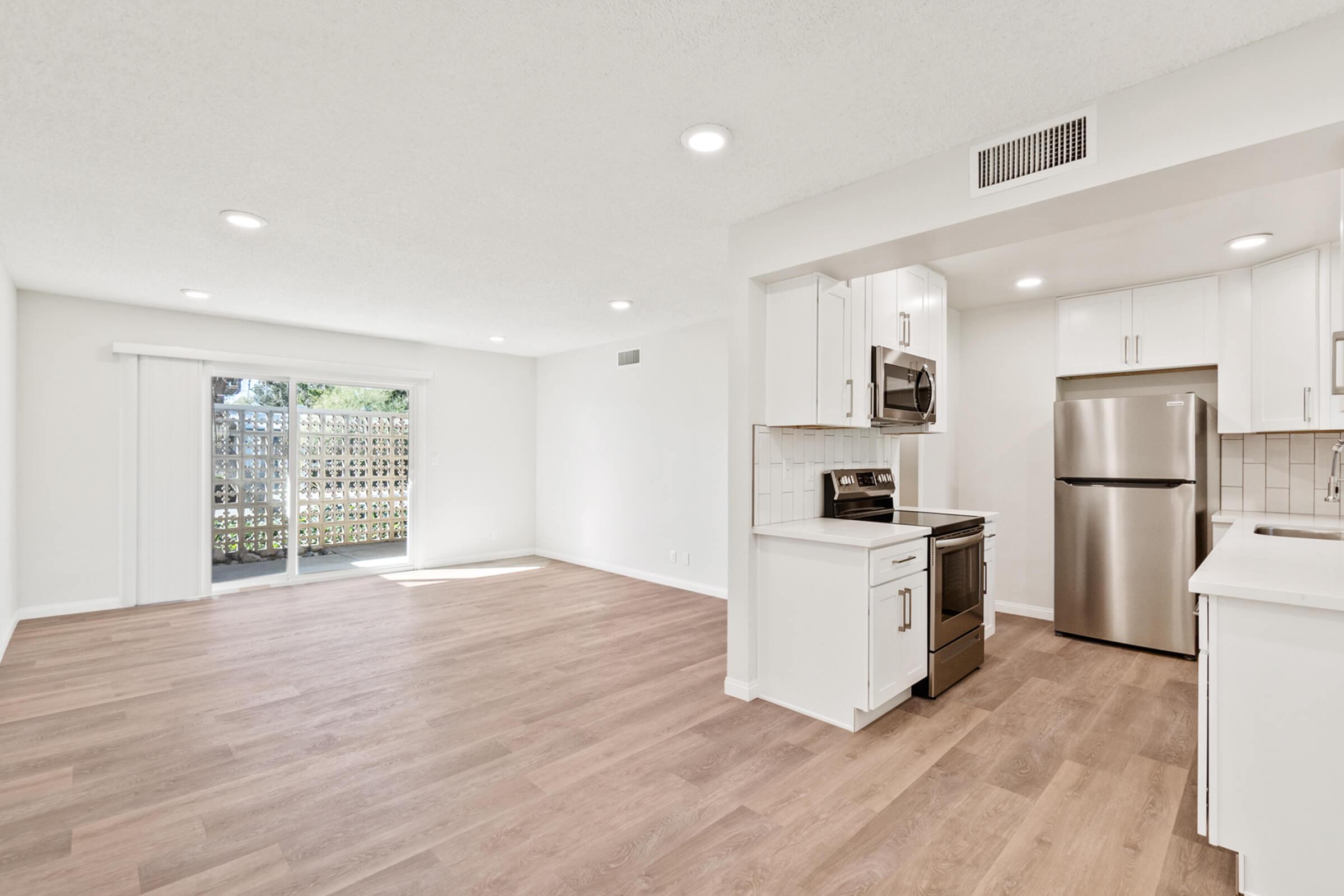 a kitchen with a wood floor