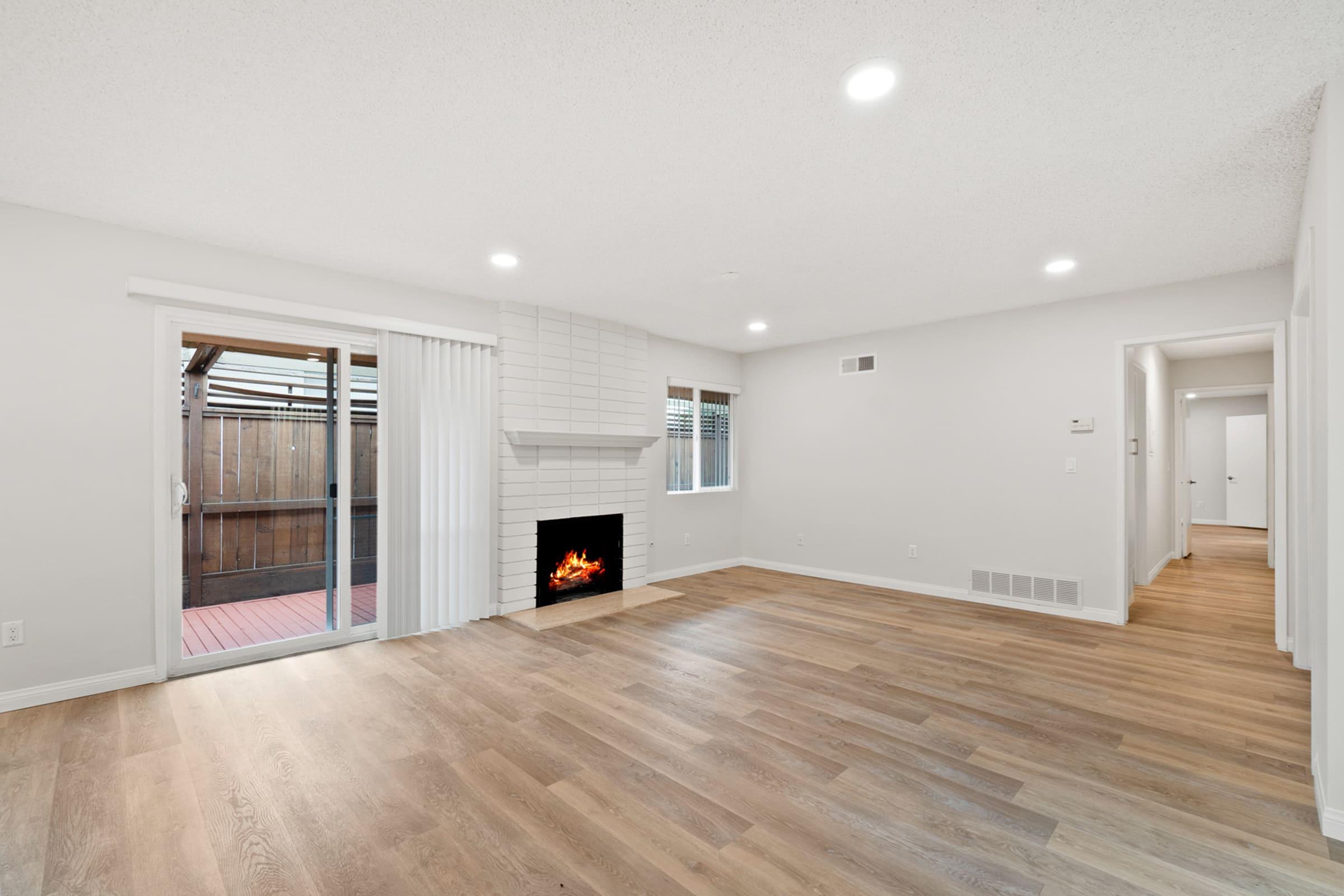 a large empty room with a wood floor