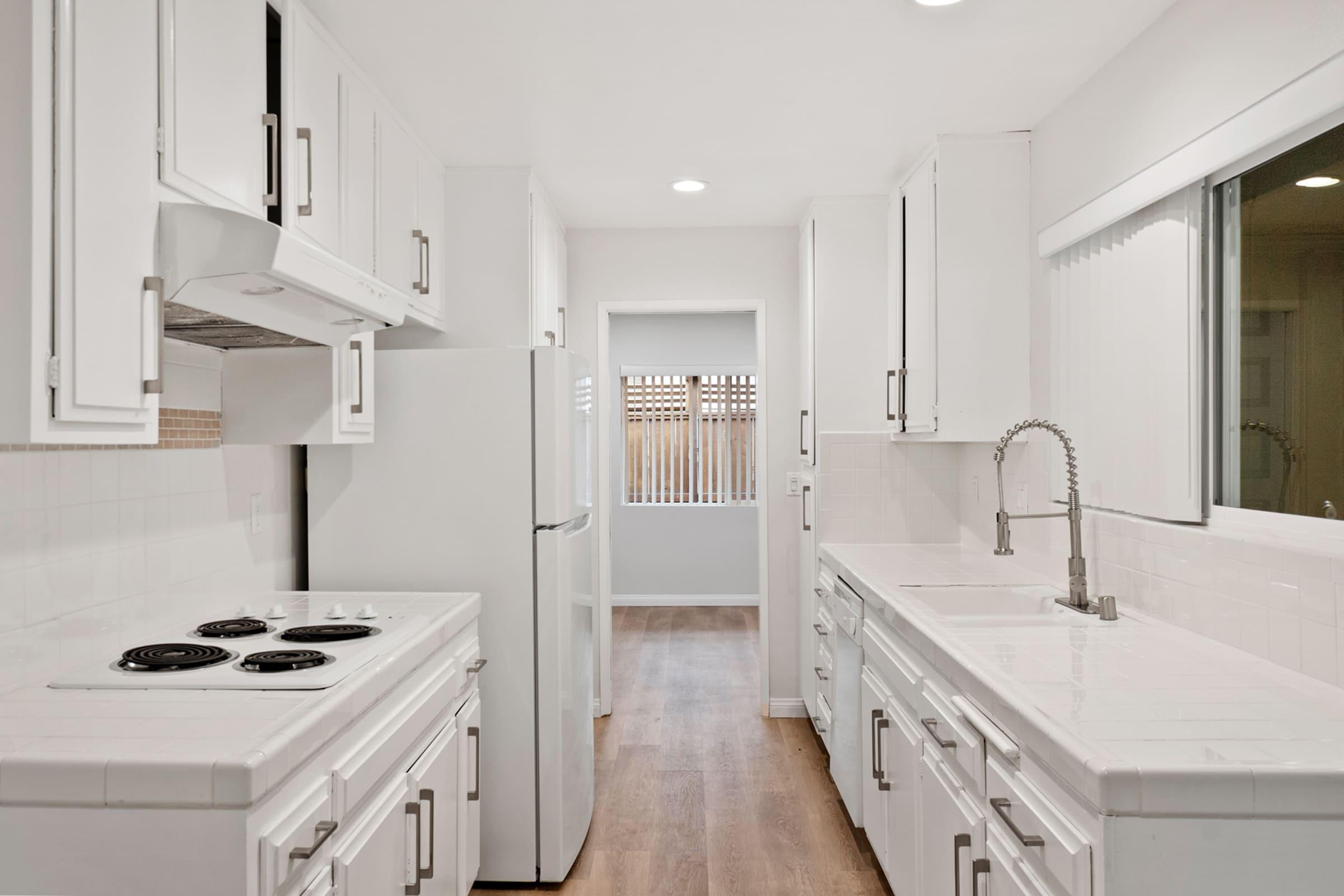 a kitchen with a stove and a sink