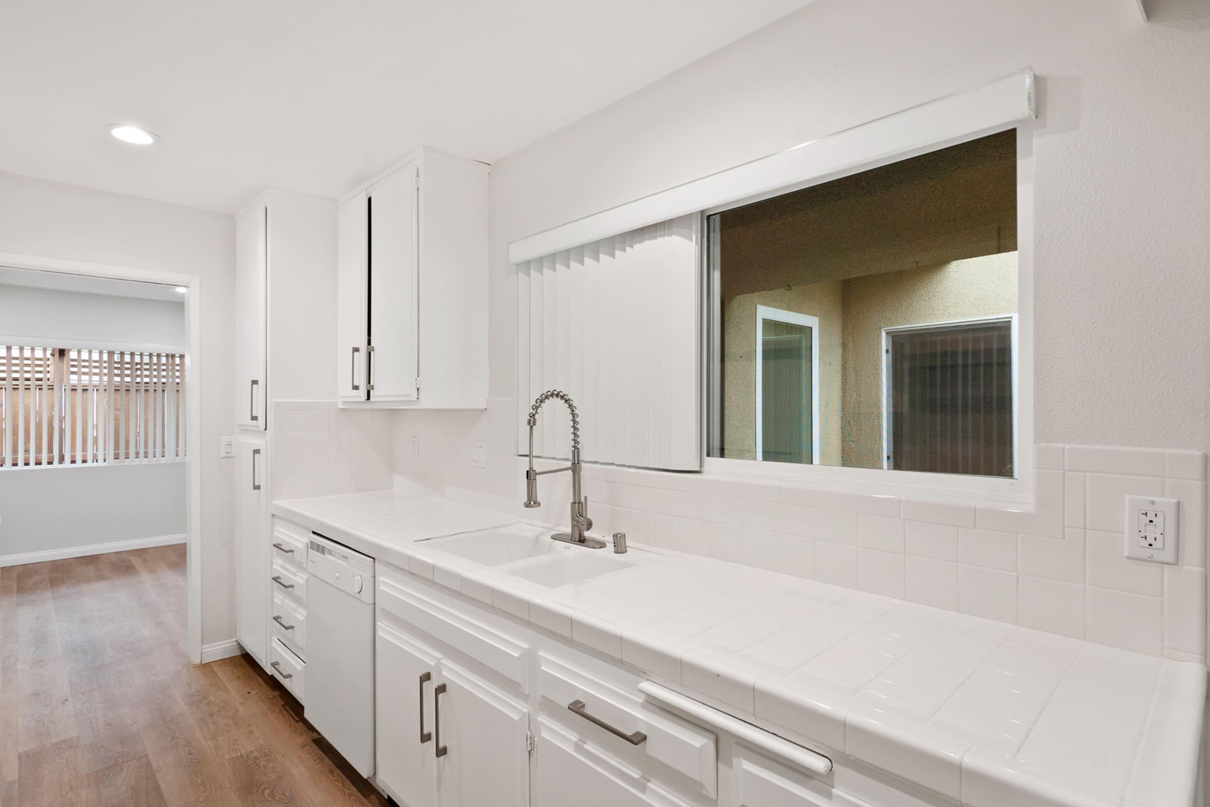 a kitchen with a sink and a window