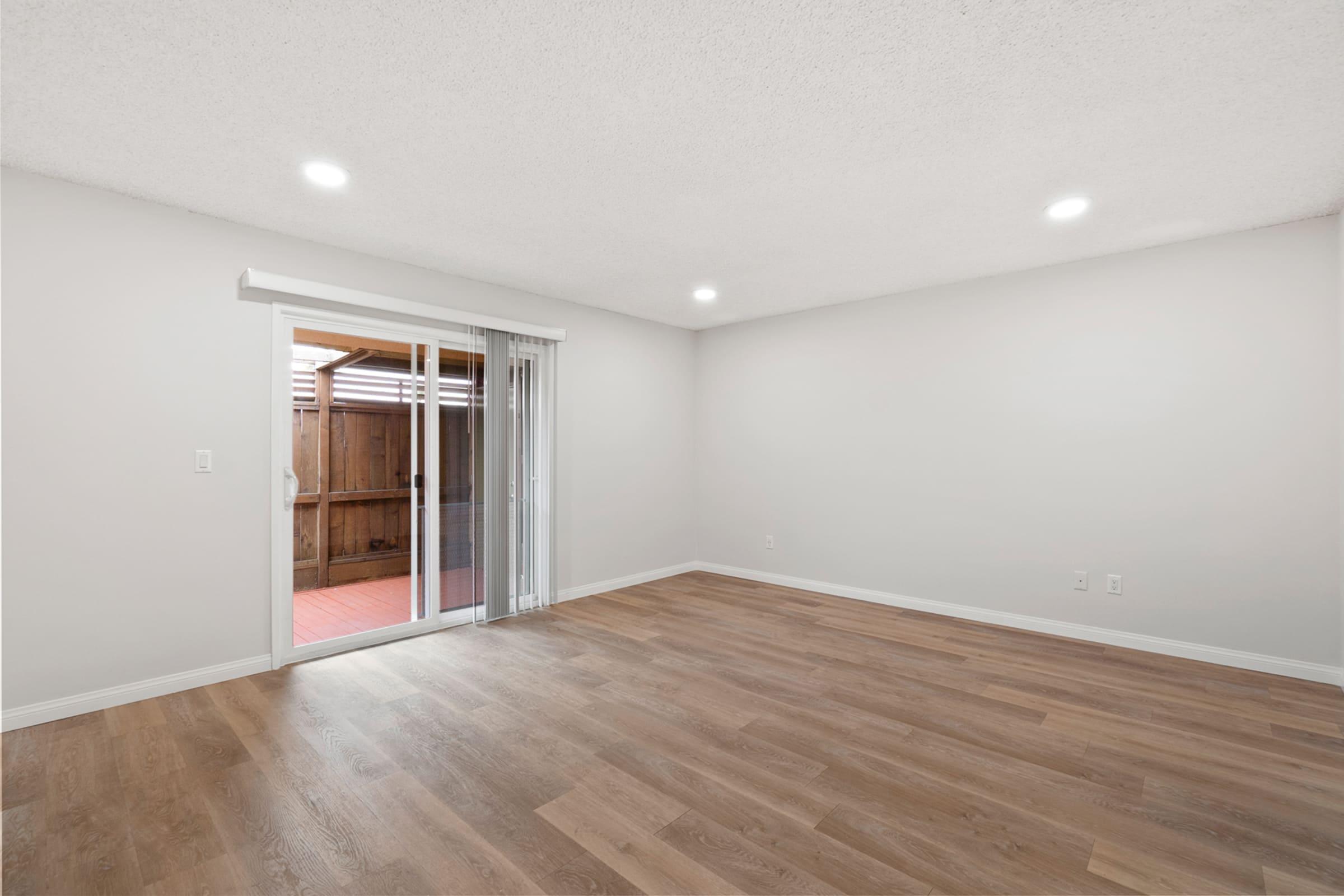 a large empty room with a wooden floor