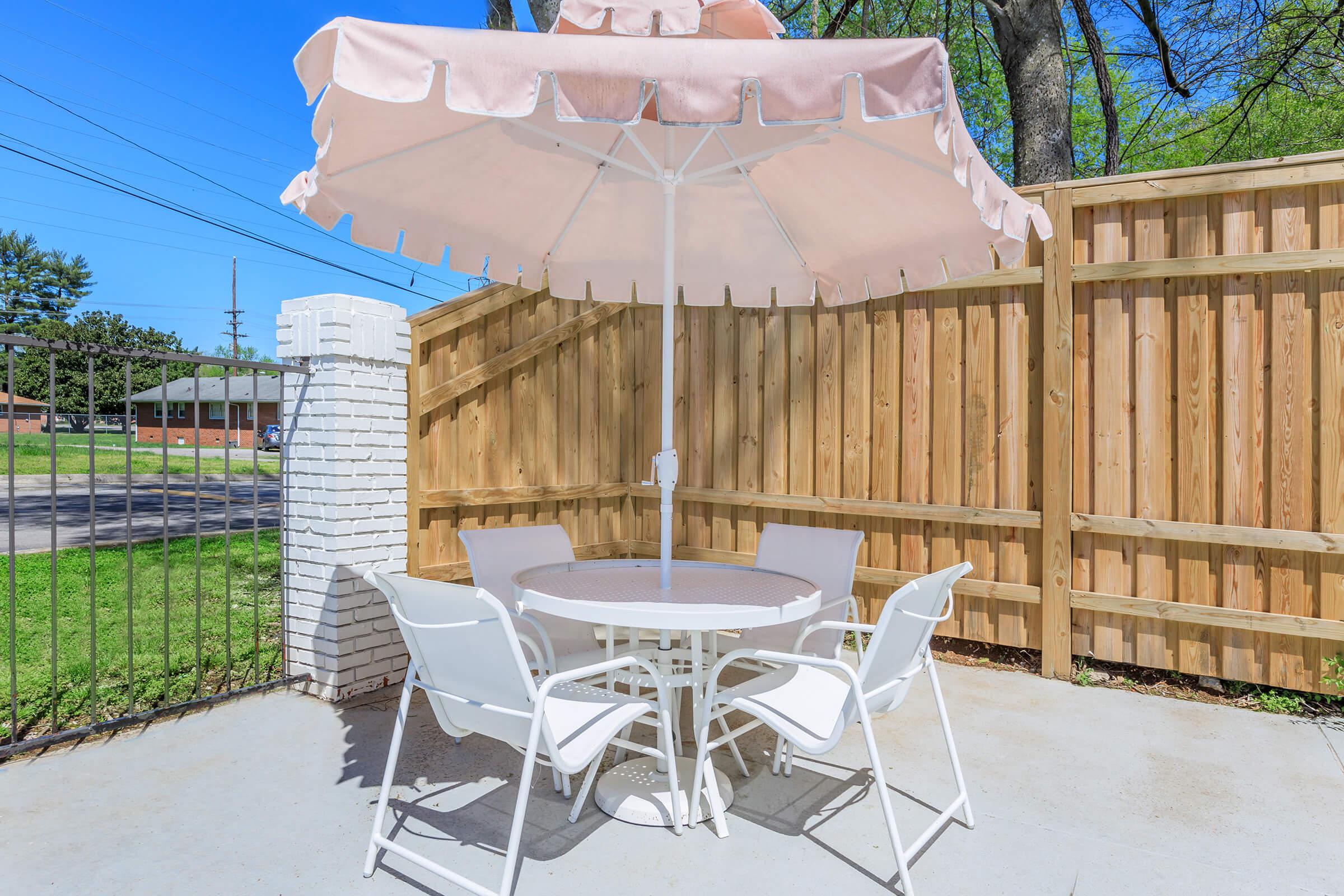 Pool deck tables for resident use at The Roosevelt Apartment Homes