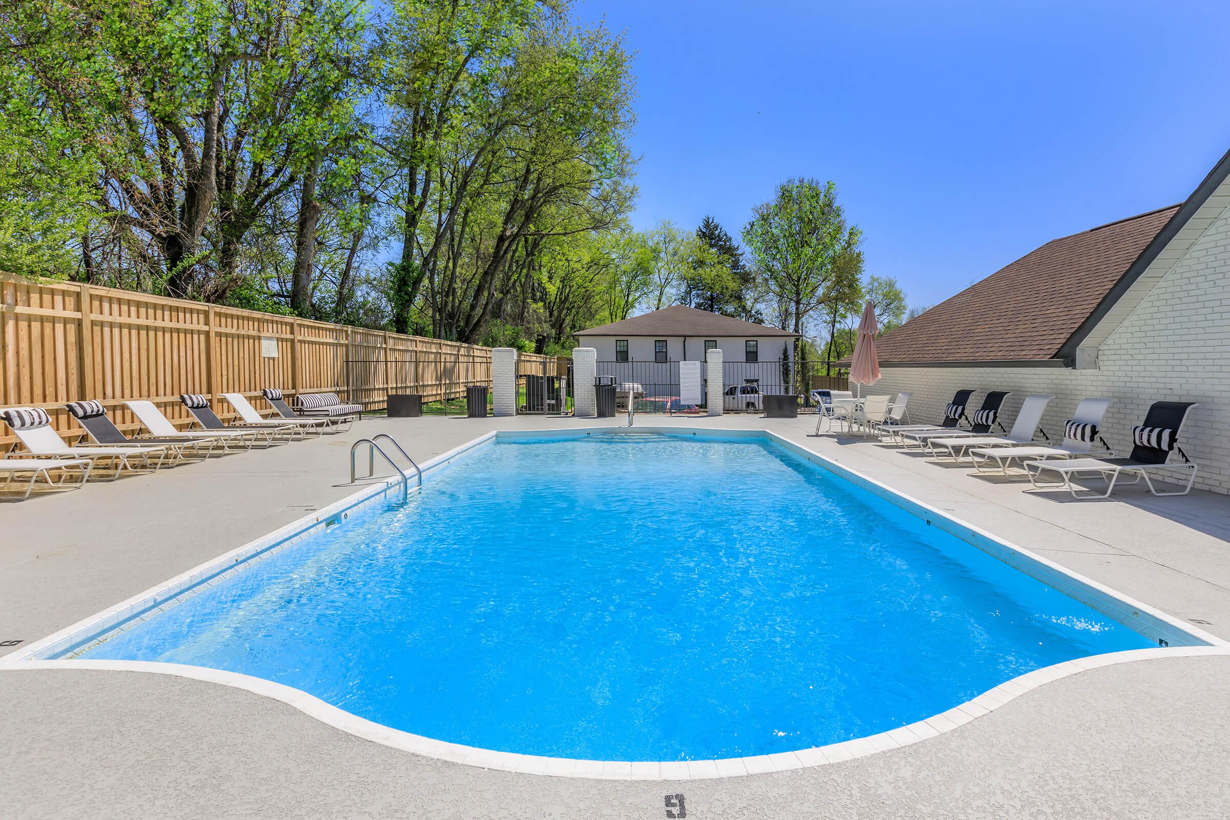 The Roosevelt Apartment Home apartments' in Murfreesboro, Tennessee shimmering swimming pool.