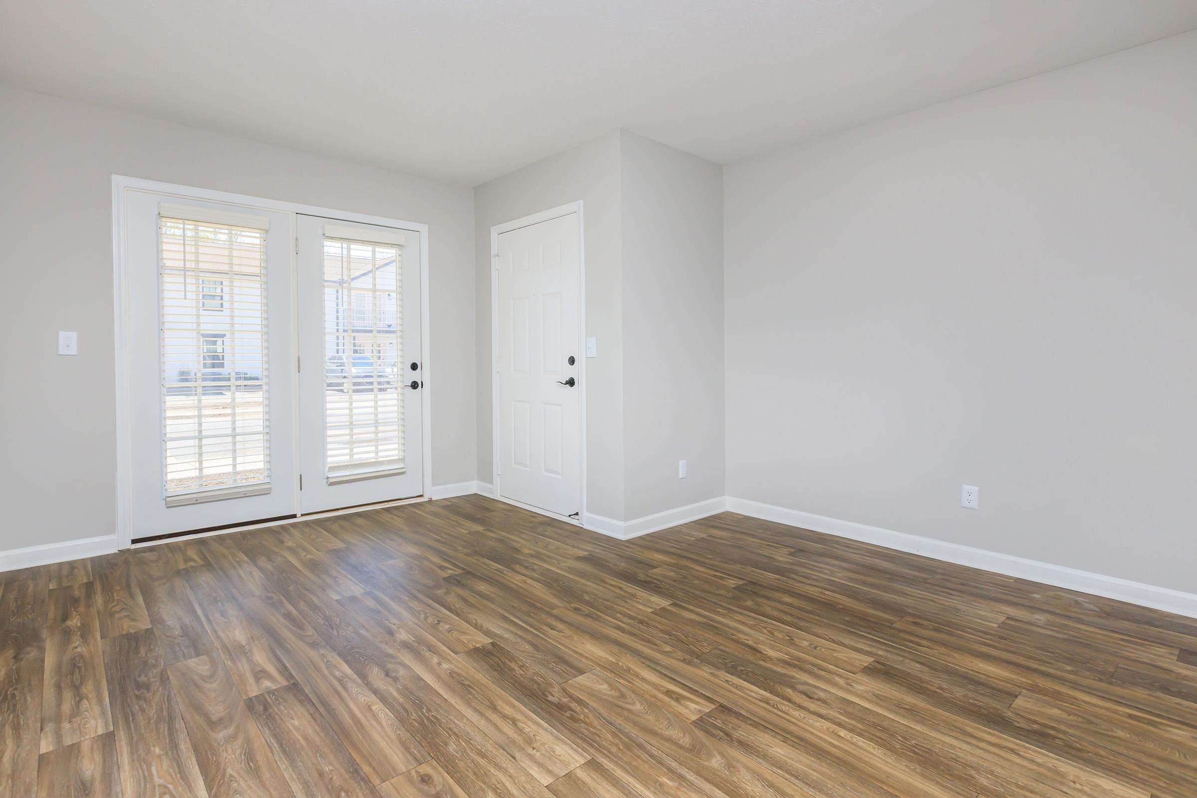 Large living area with doors to access the balcony or patio.