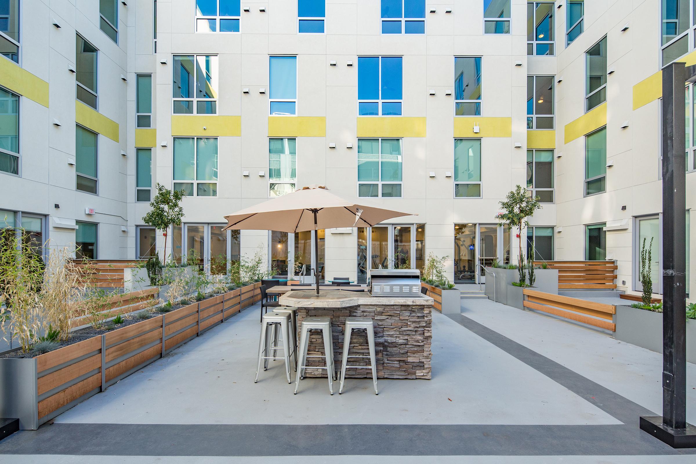 courtyard with barbecue and fire pit.