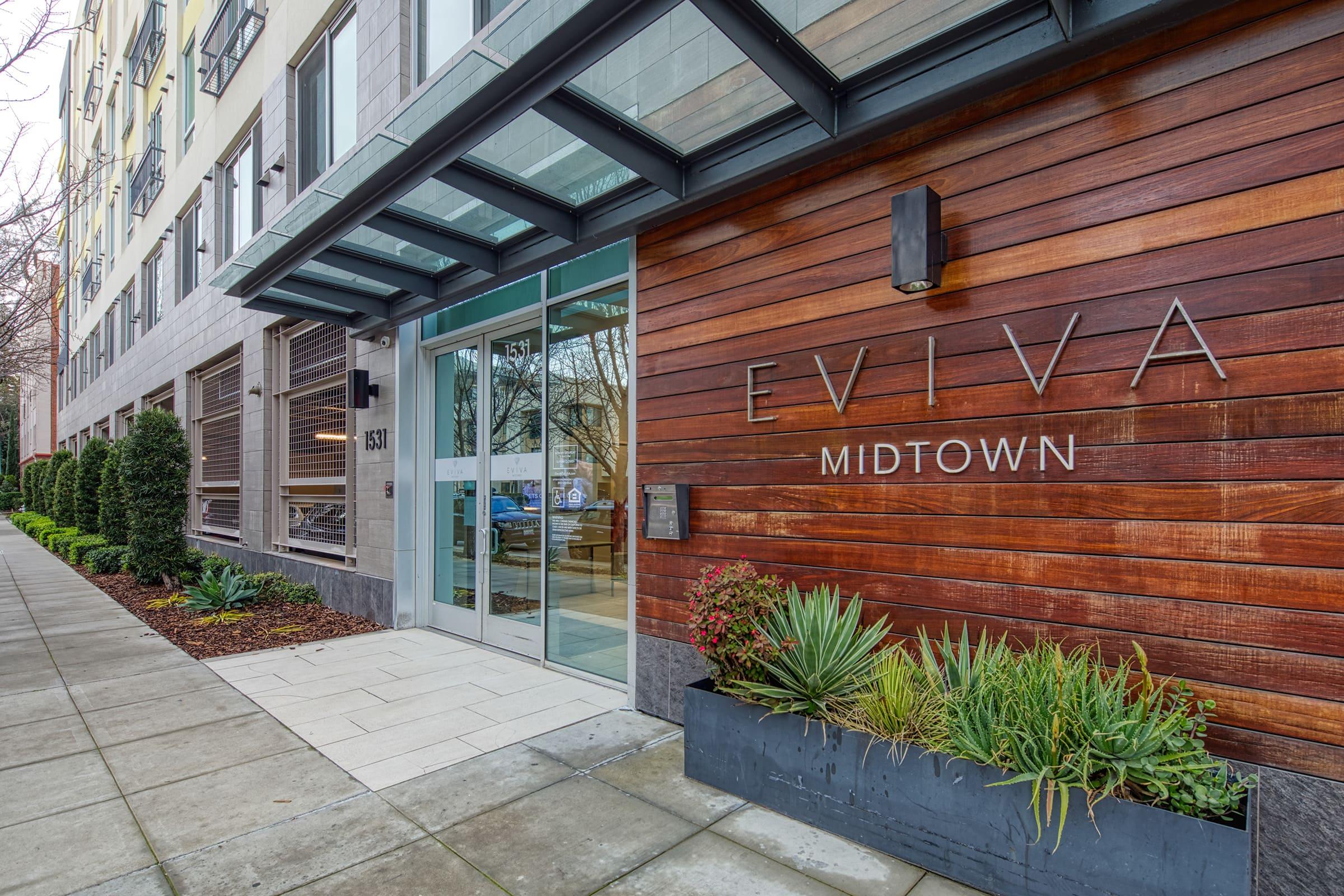 front of building with logo for eviva midtown.