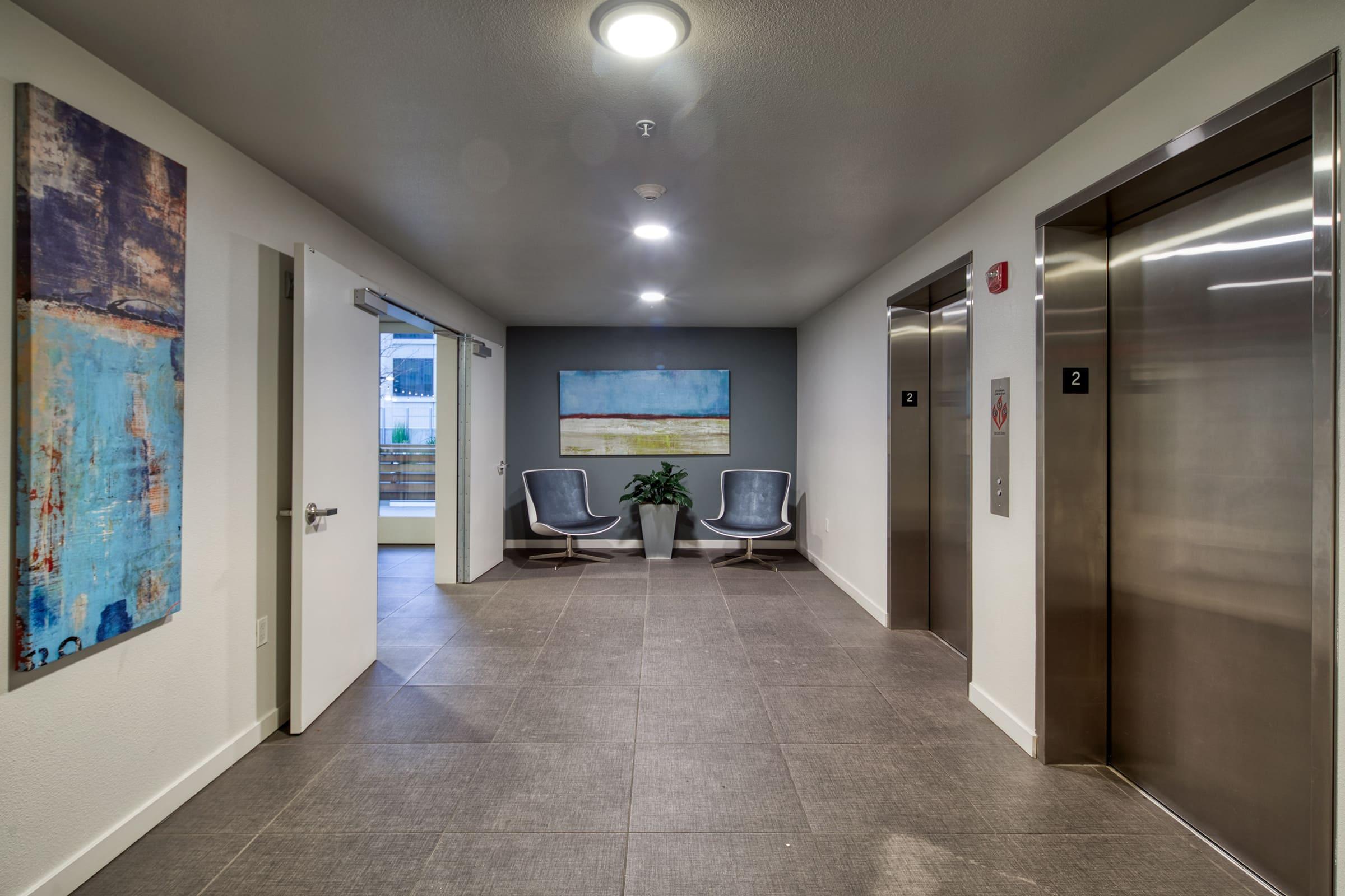 hallway with elevators.