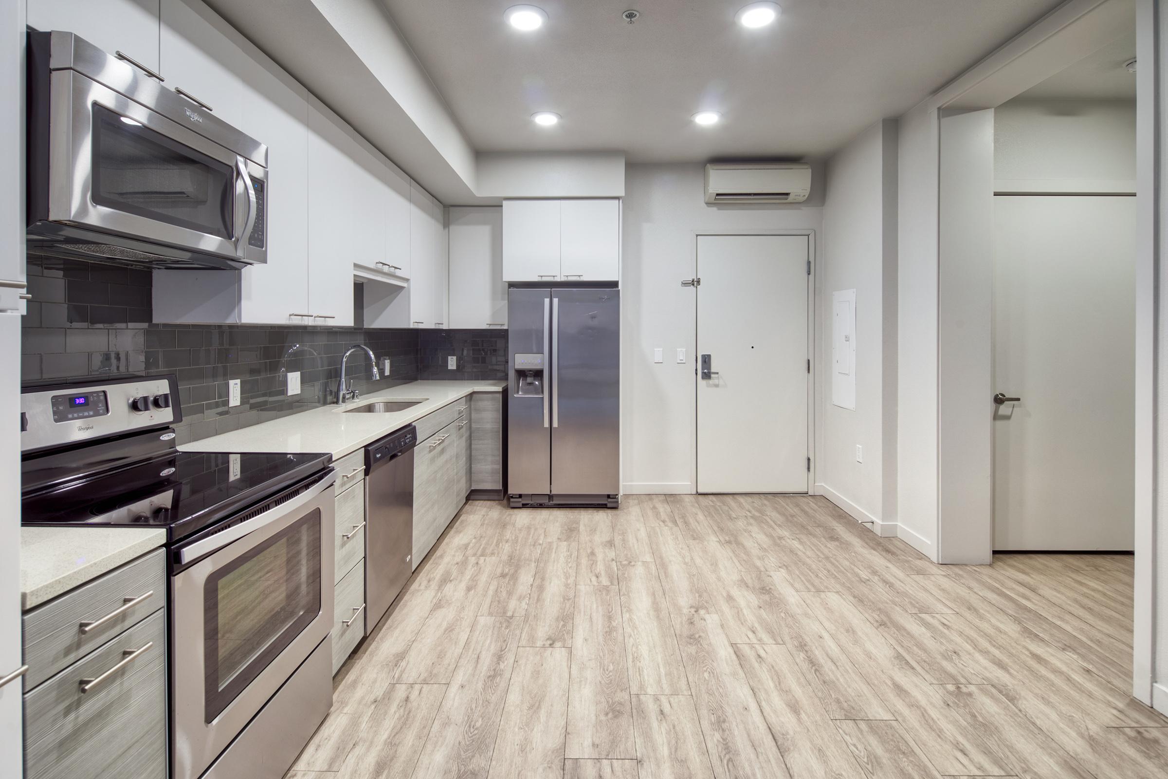 sink, refrigerator, microwave, and stove in the kitchen.