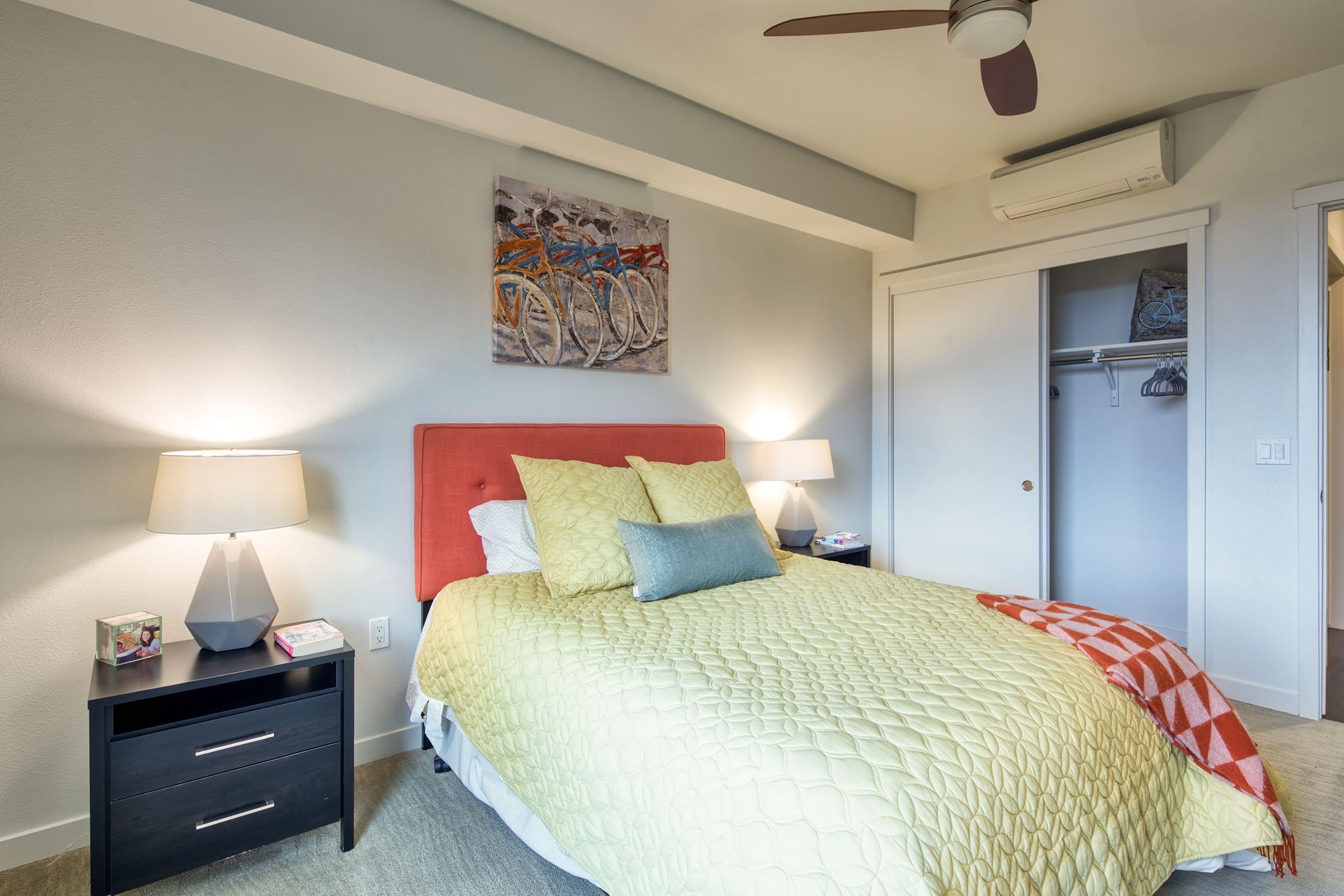 bedroom with ceiling fan and closet and plush carpet.