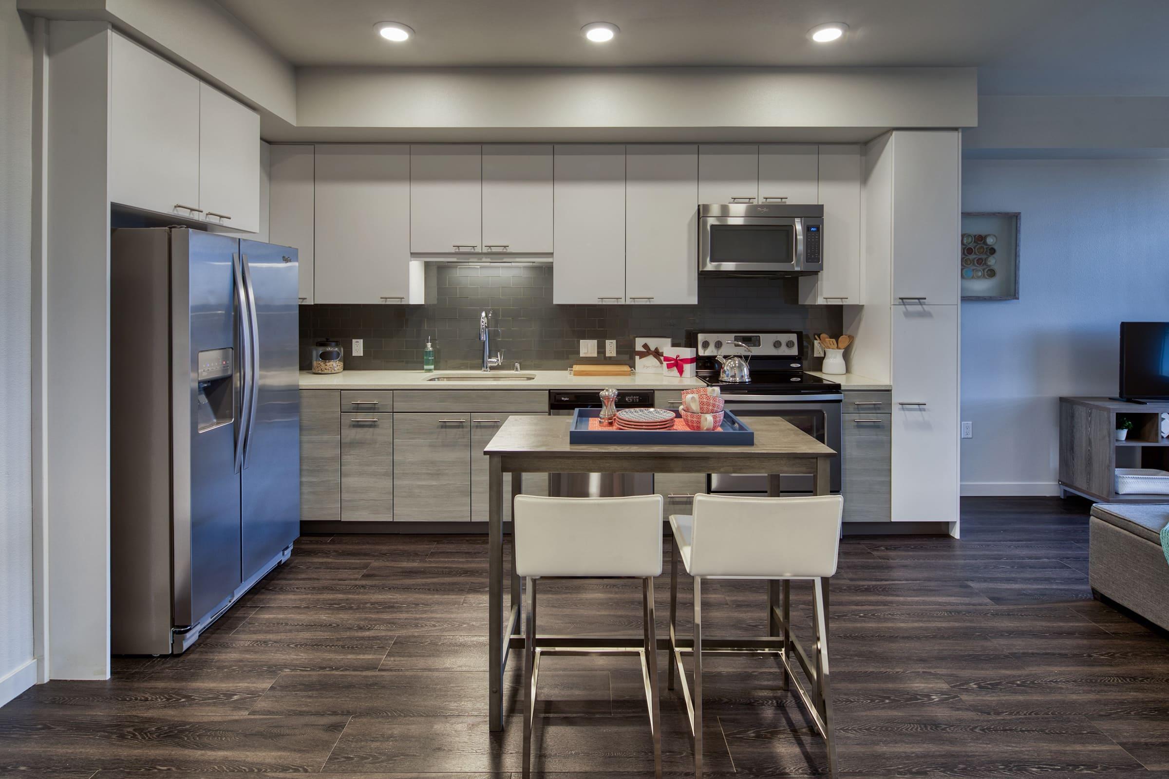 kitchen and dining area with wood style vinyl plank flooring.