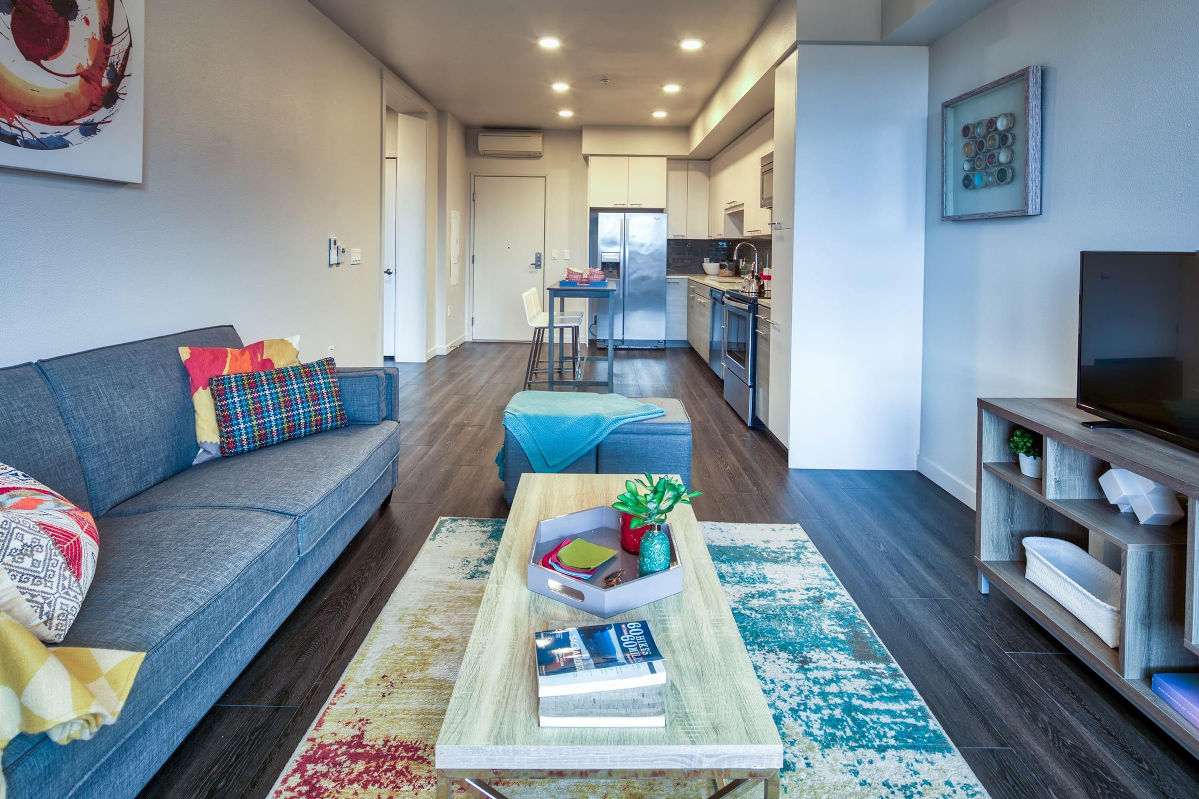 living room with couch coffee table and television.