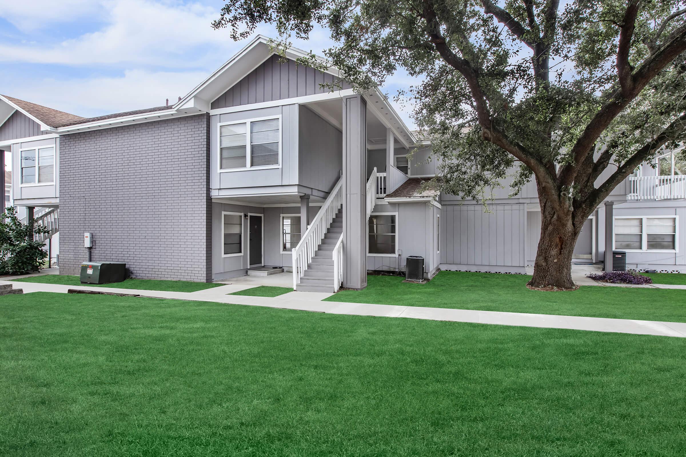 a large lawn in front of a house