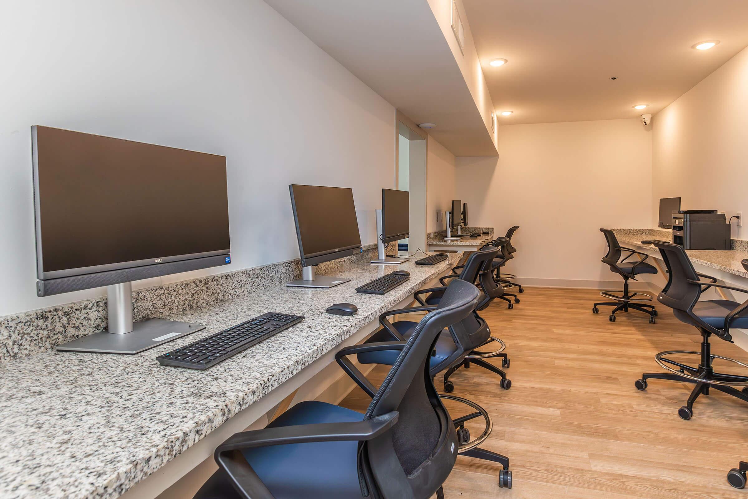 an office with a desk and chair in a room