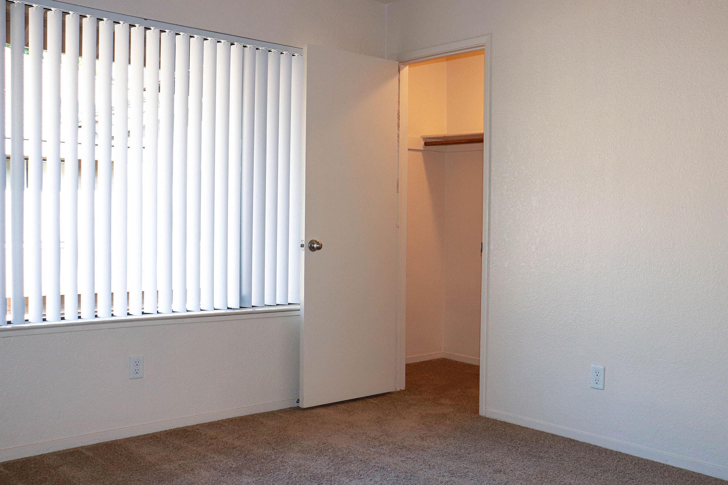 a white refrigerator freezer sitting inside of a building