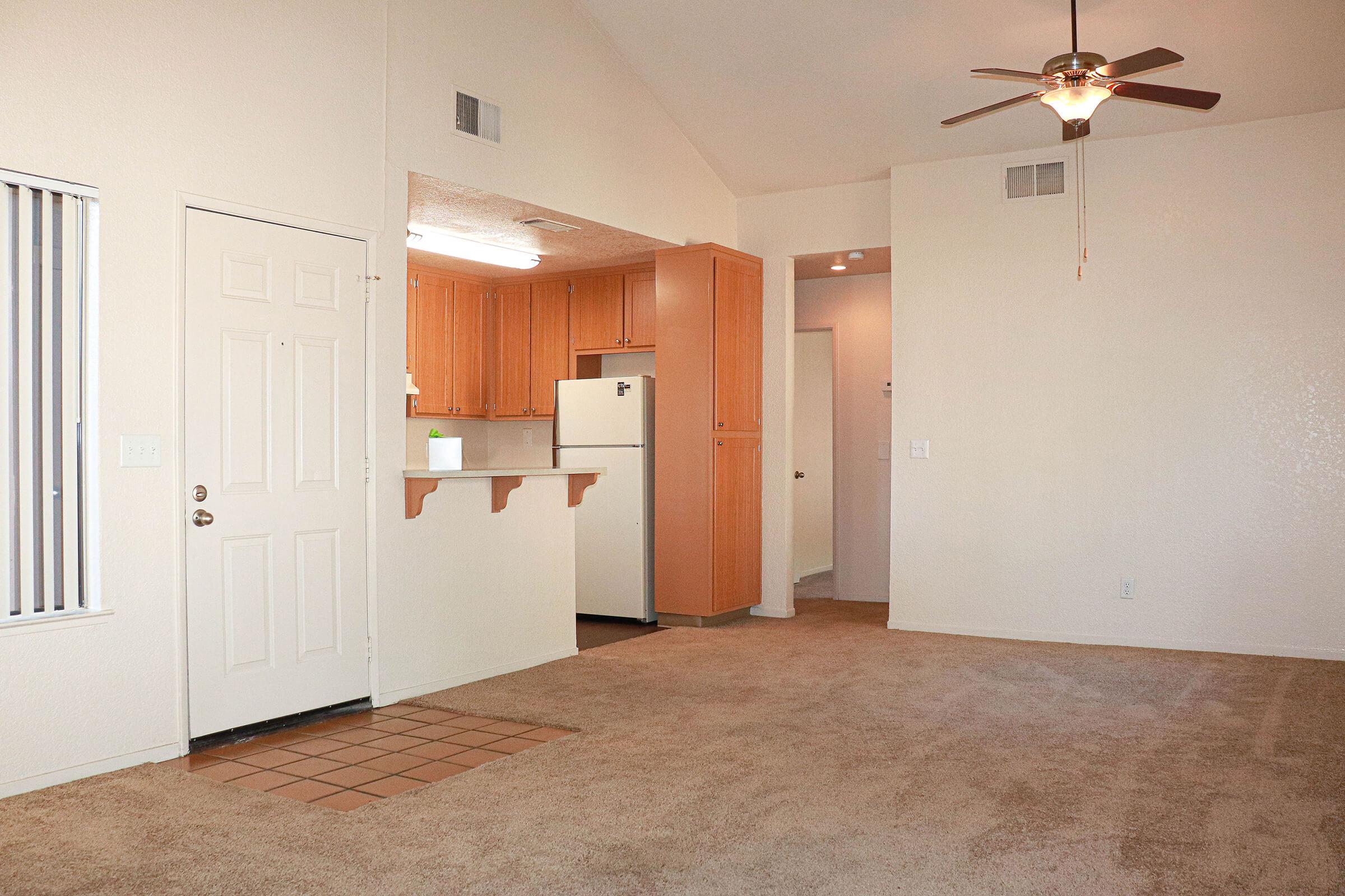 a white refrigerator freezer sitting inside of a house