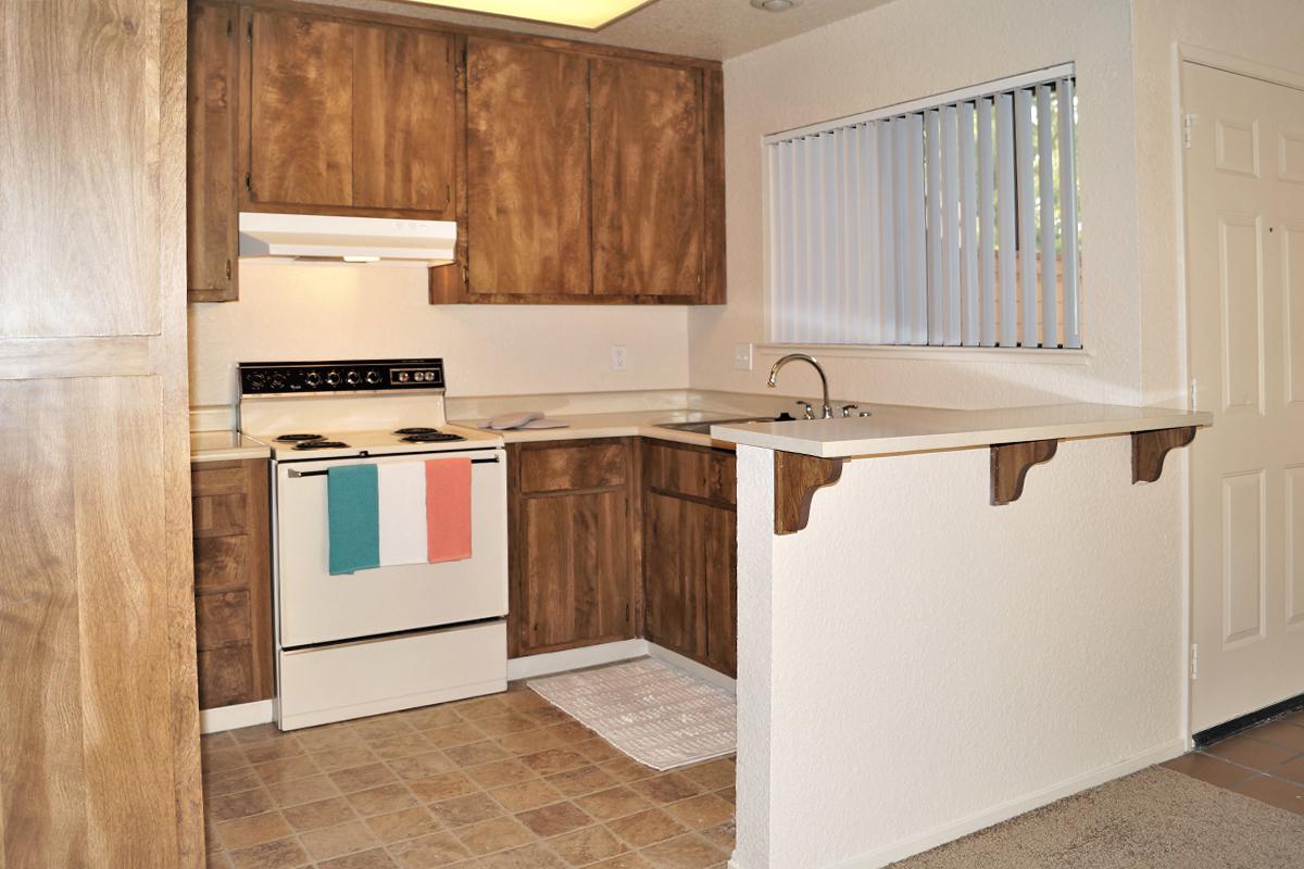 a kitchen with a stove and a refrigerator