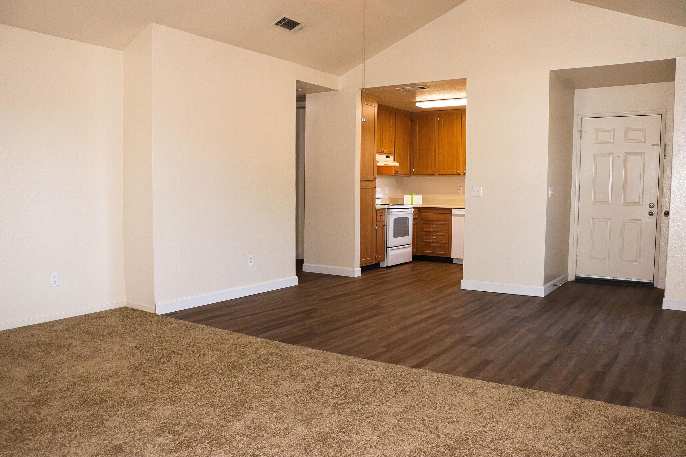 a kitchen with a wooden floor