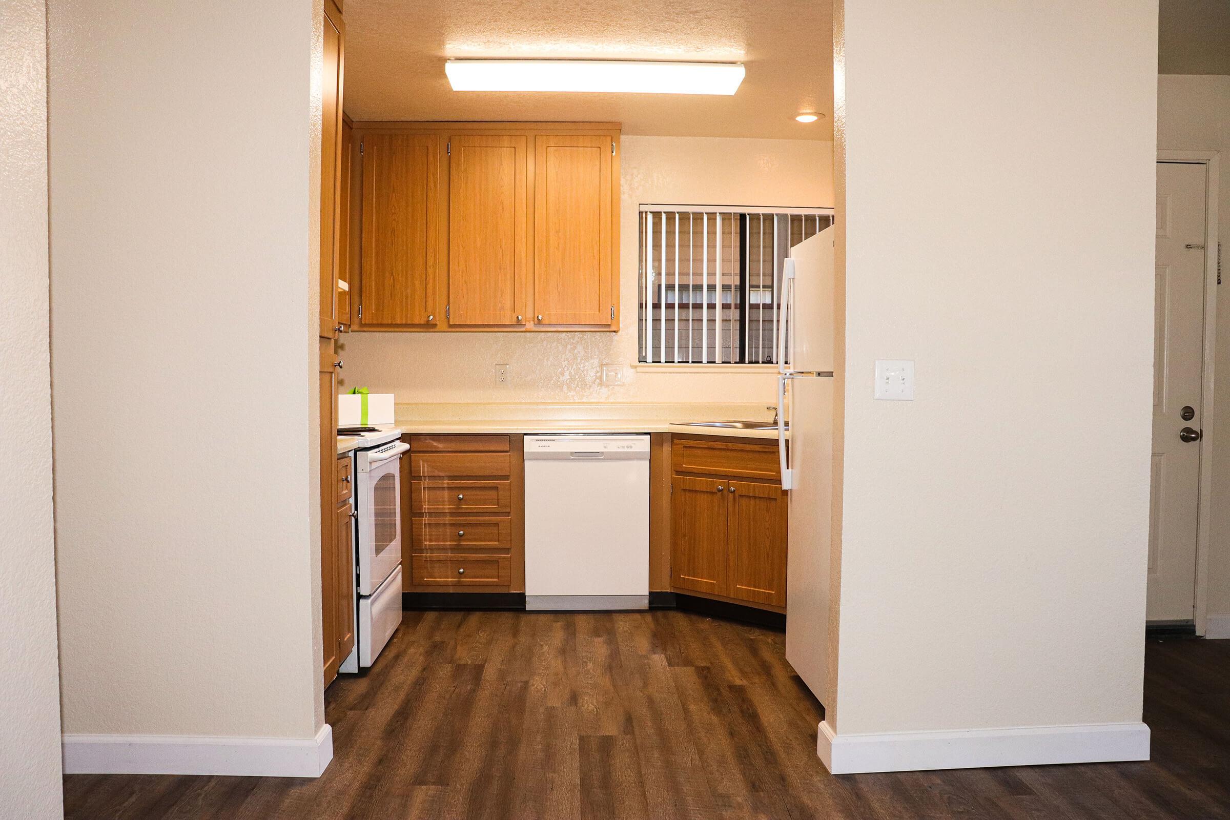 a kitchen with a stove and a refrigerator