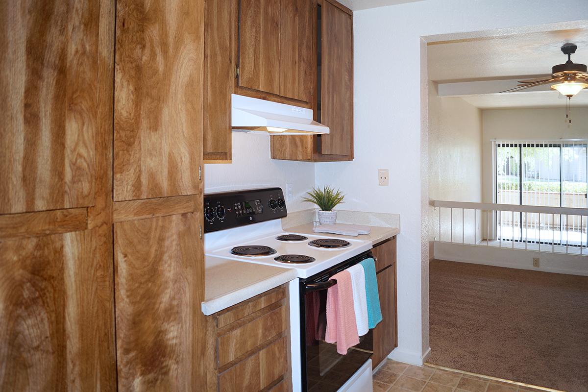 a kitchen with a sink and a mirror