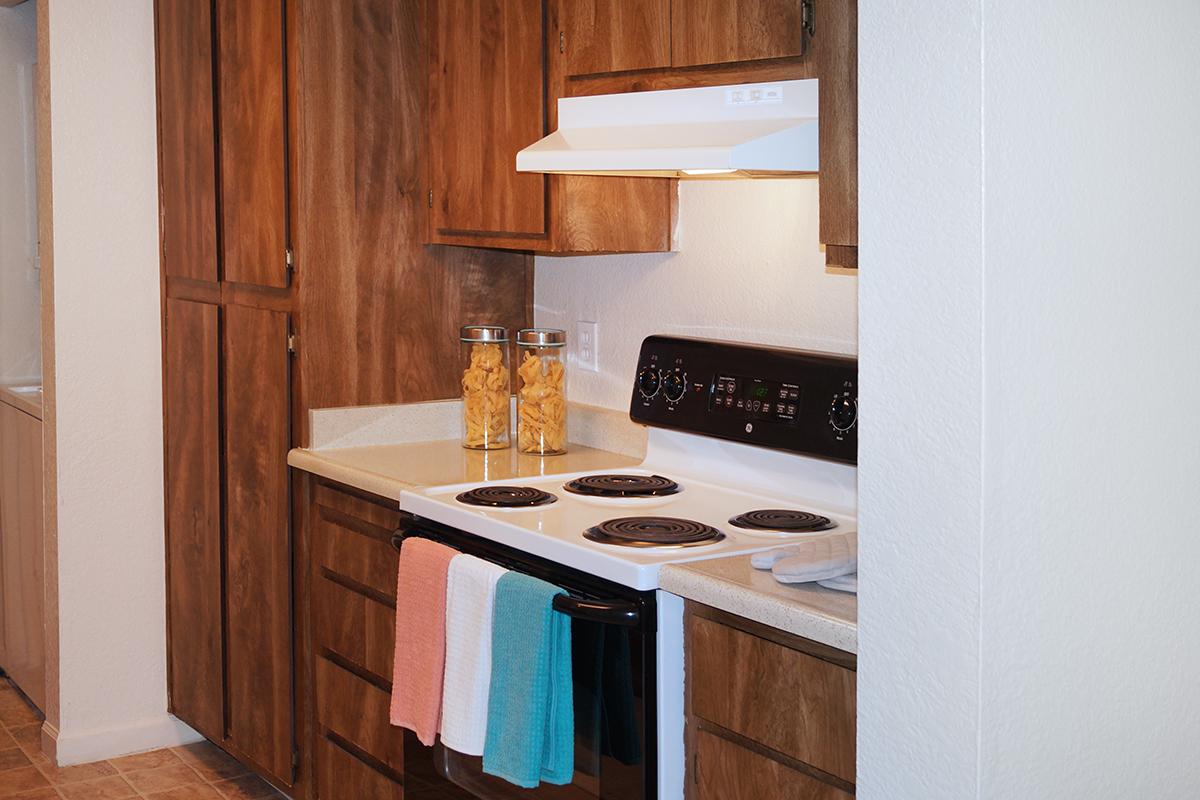 a kitchen with a stove top oven sitting inside of a refrigerator