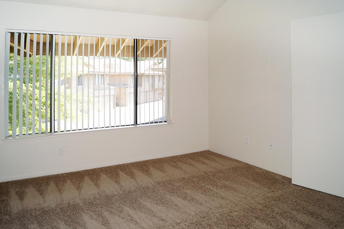 a bedroom with a large window