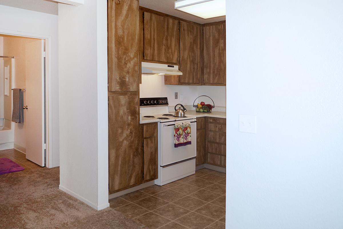 a white refrigerator freezer sitting inside of a kitchen